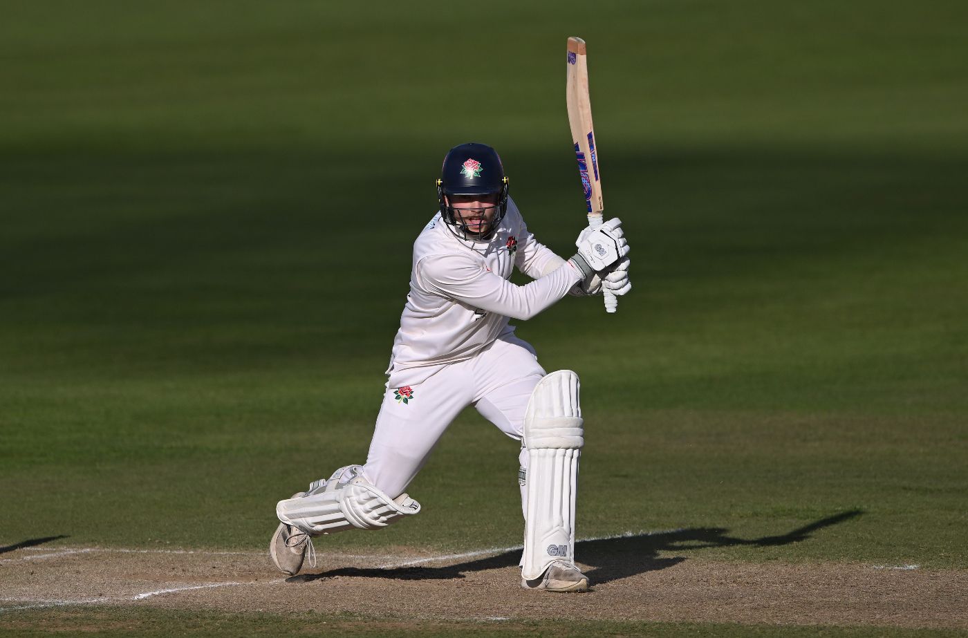 Matty Hurst drives through the covers for Lancashire