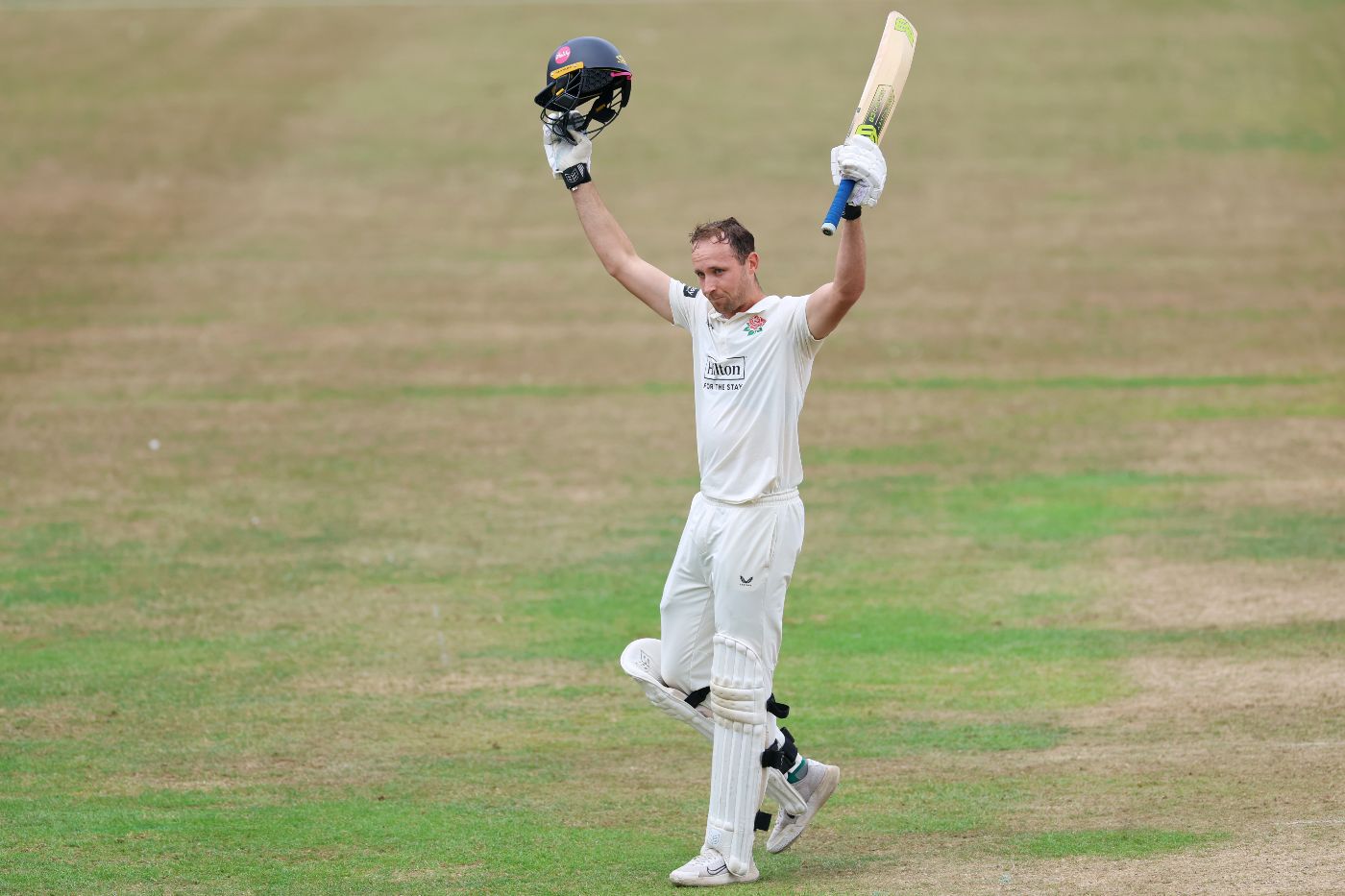Tom Hartley celebrates his maiden first-class hundred