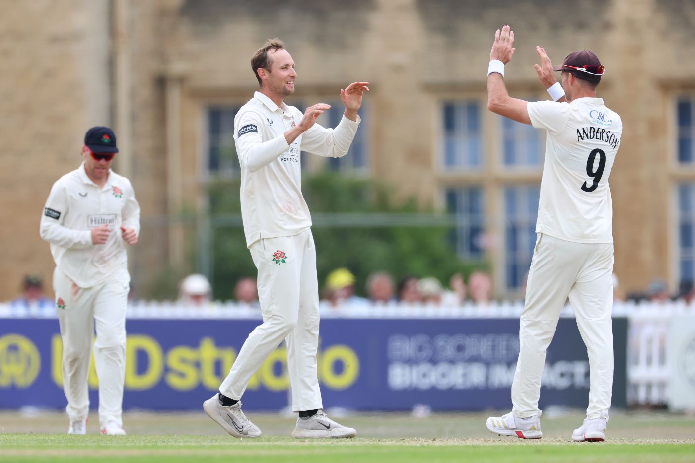 Tom Hartley and James Anderson celebrate another of his wickets