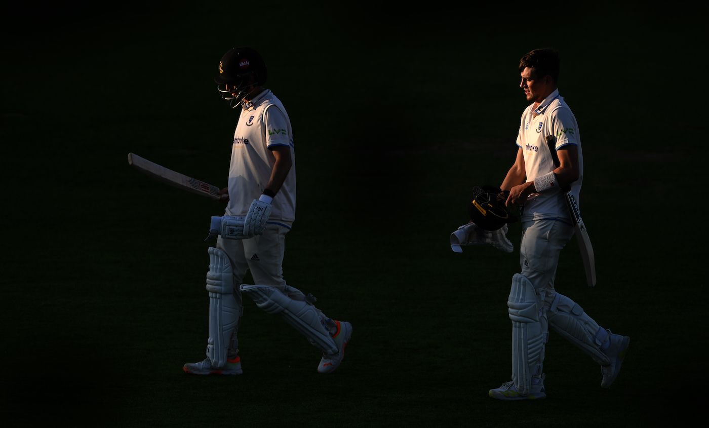 Fynn Hudson-Prentice and Henry Crocombe leave the field in the late evening sunshine