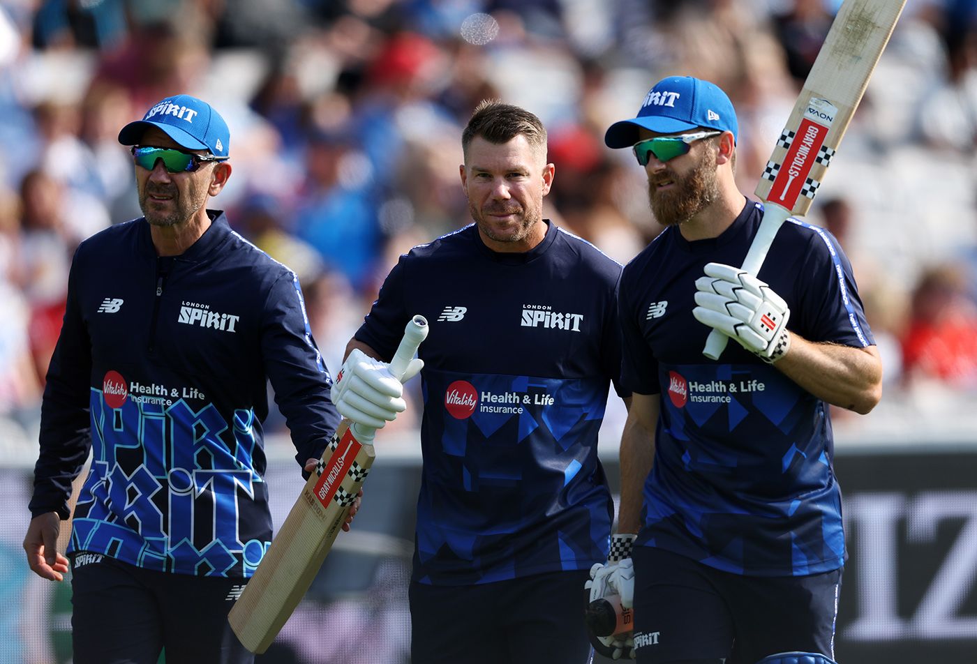 Justin Langer, David Warner and Kane Williamson arrive before the game