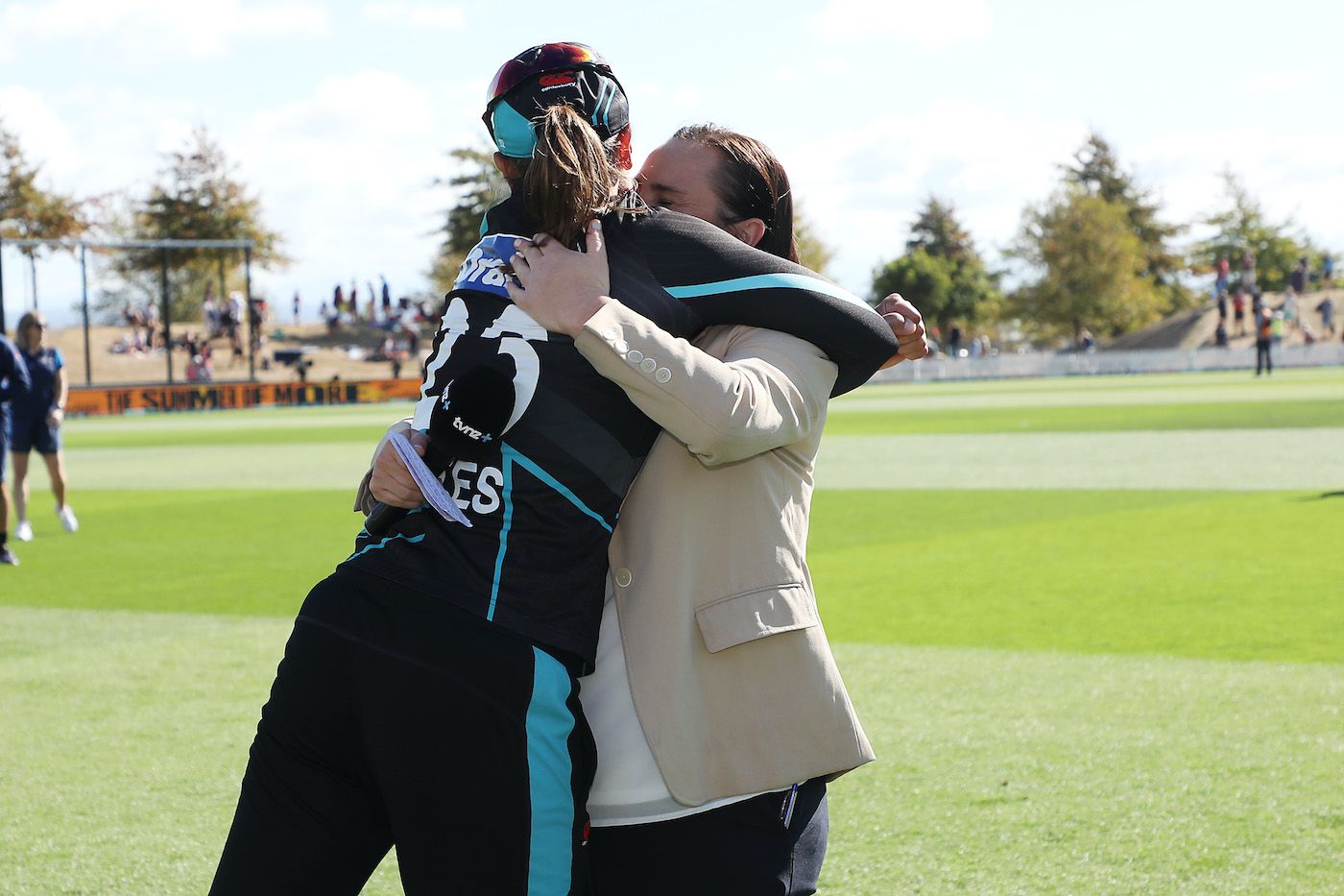Katey Martin gets a big hug from Suzie Bates