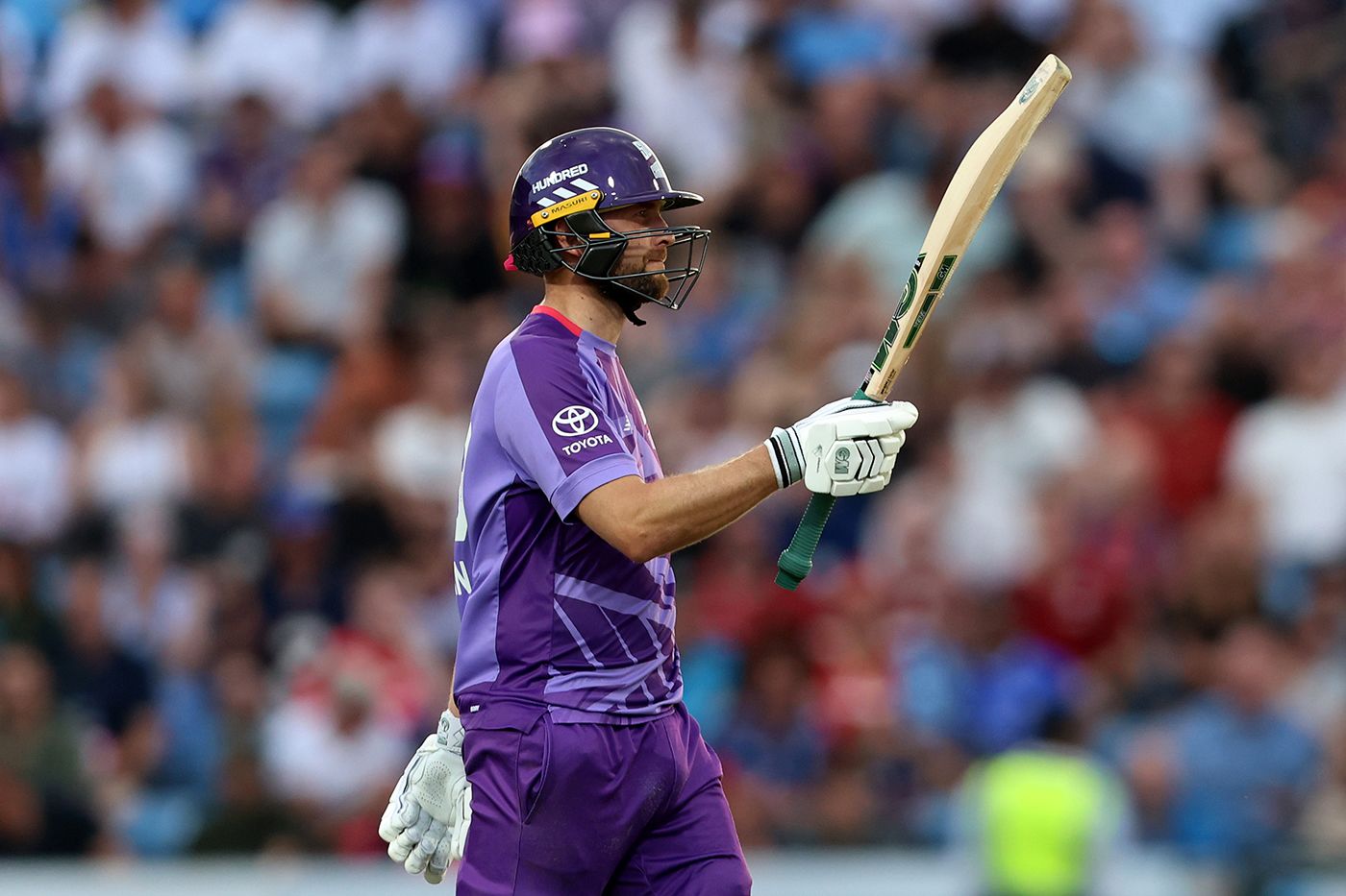 Dawid Malan raises his bat on reaching fifty
