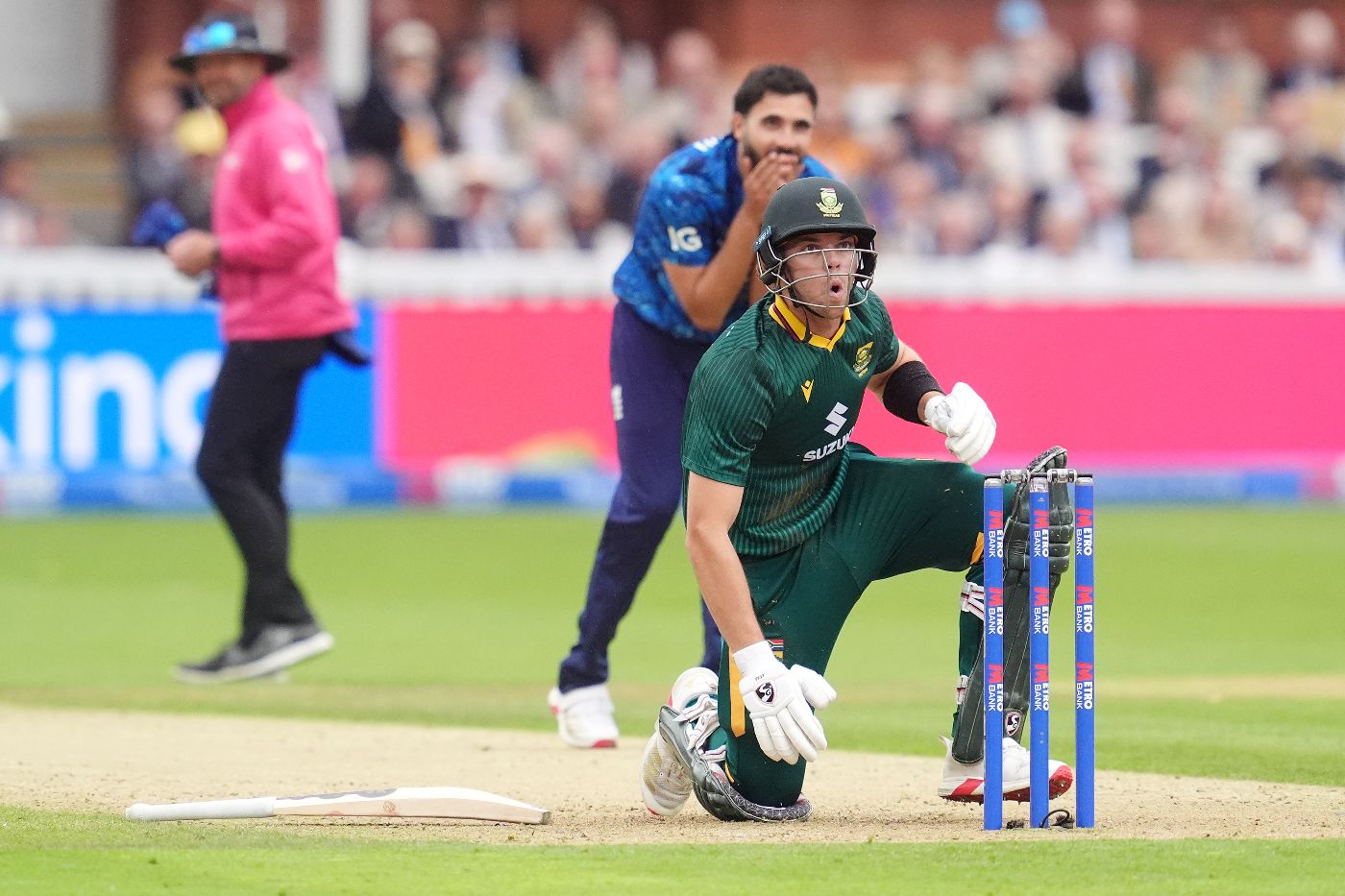 Tristan Stubbs looks shocked after losing his grip and nearly landing his bat on the stumps