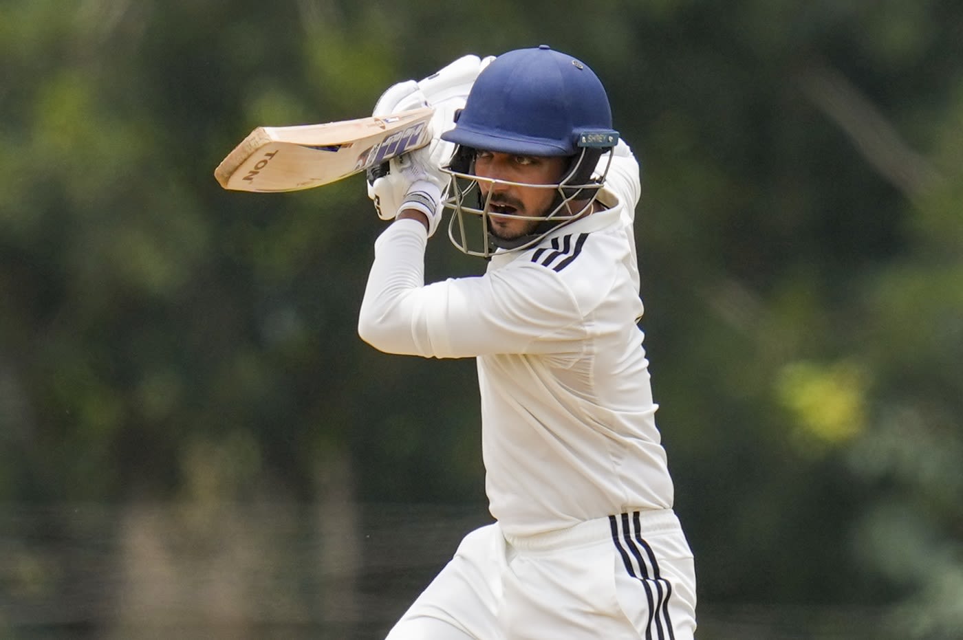 Tanmay Agarwal punches with a high elbow