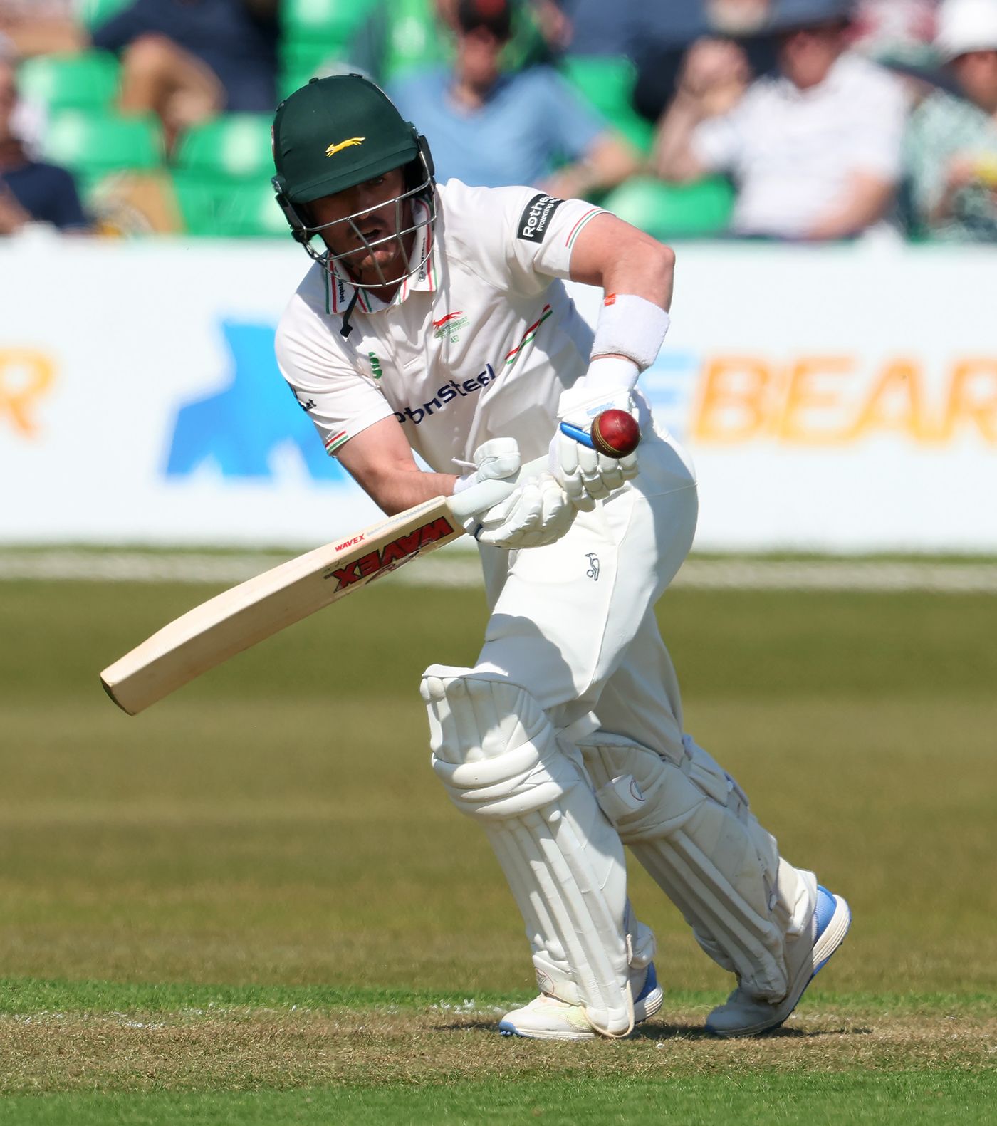 Lewis Hill tucks the ball leg side