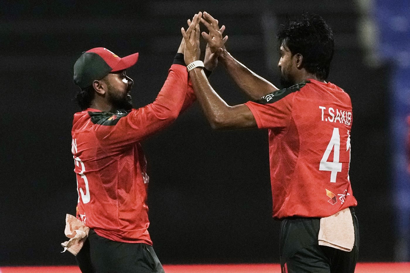 Tanzim Hasan Sakib celebrates a wicket with Litton Das