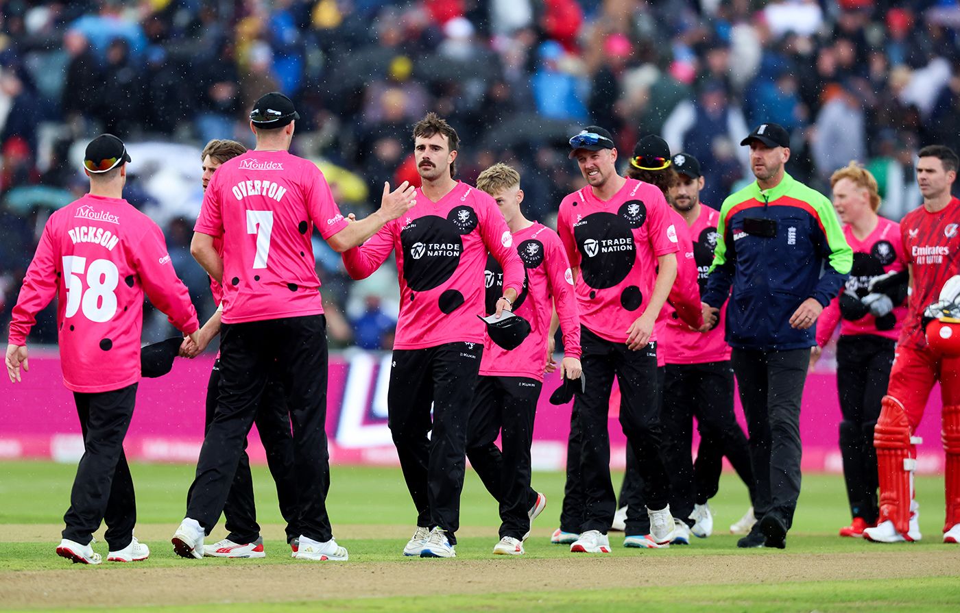 Somerset celebrate victory as the rain comes down