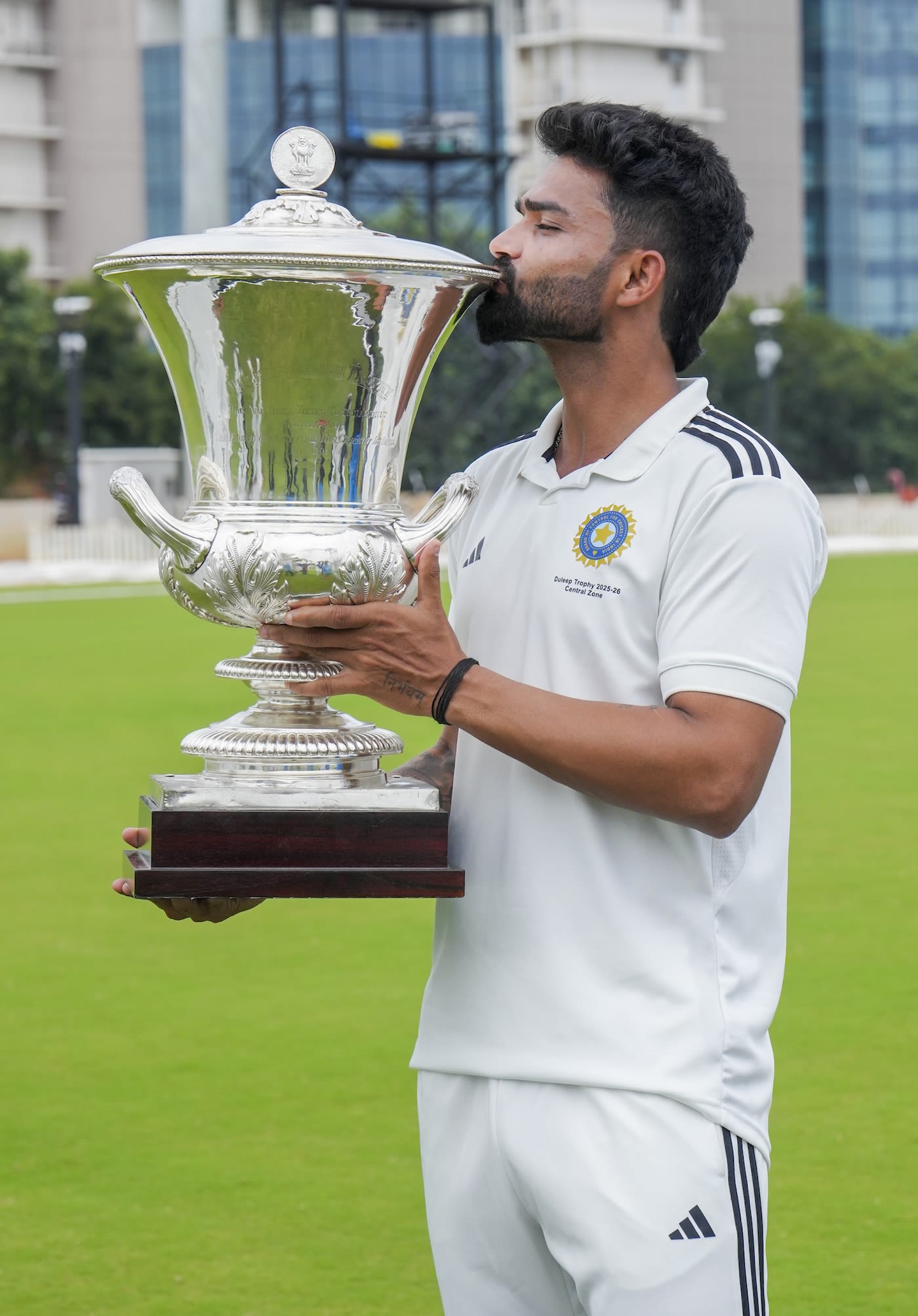 Kumar Kartikeya kisses the Duleep Trophy silverware