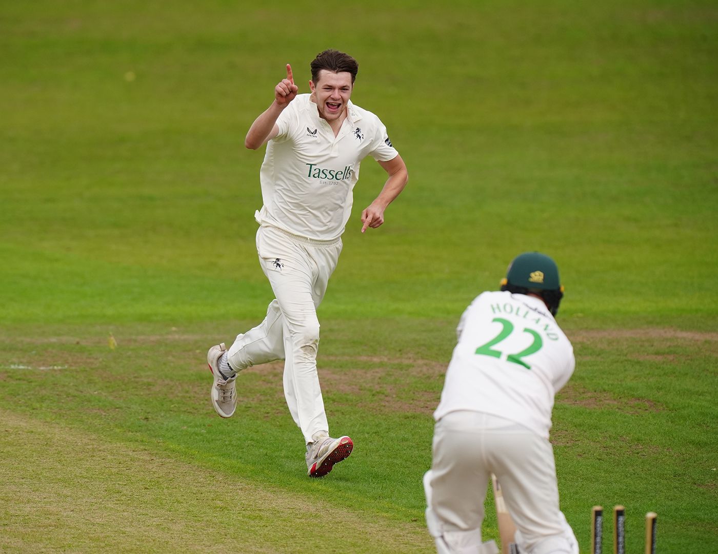George Garrett celebrates after bowling out Ian Holland