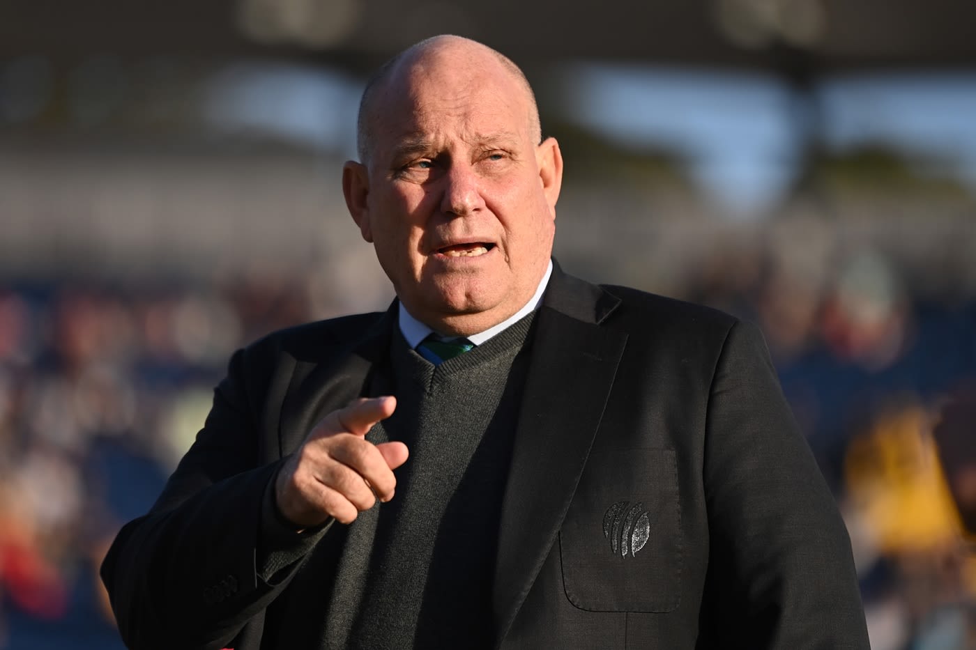 Match referee Andy Pycroft speaks to someone