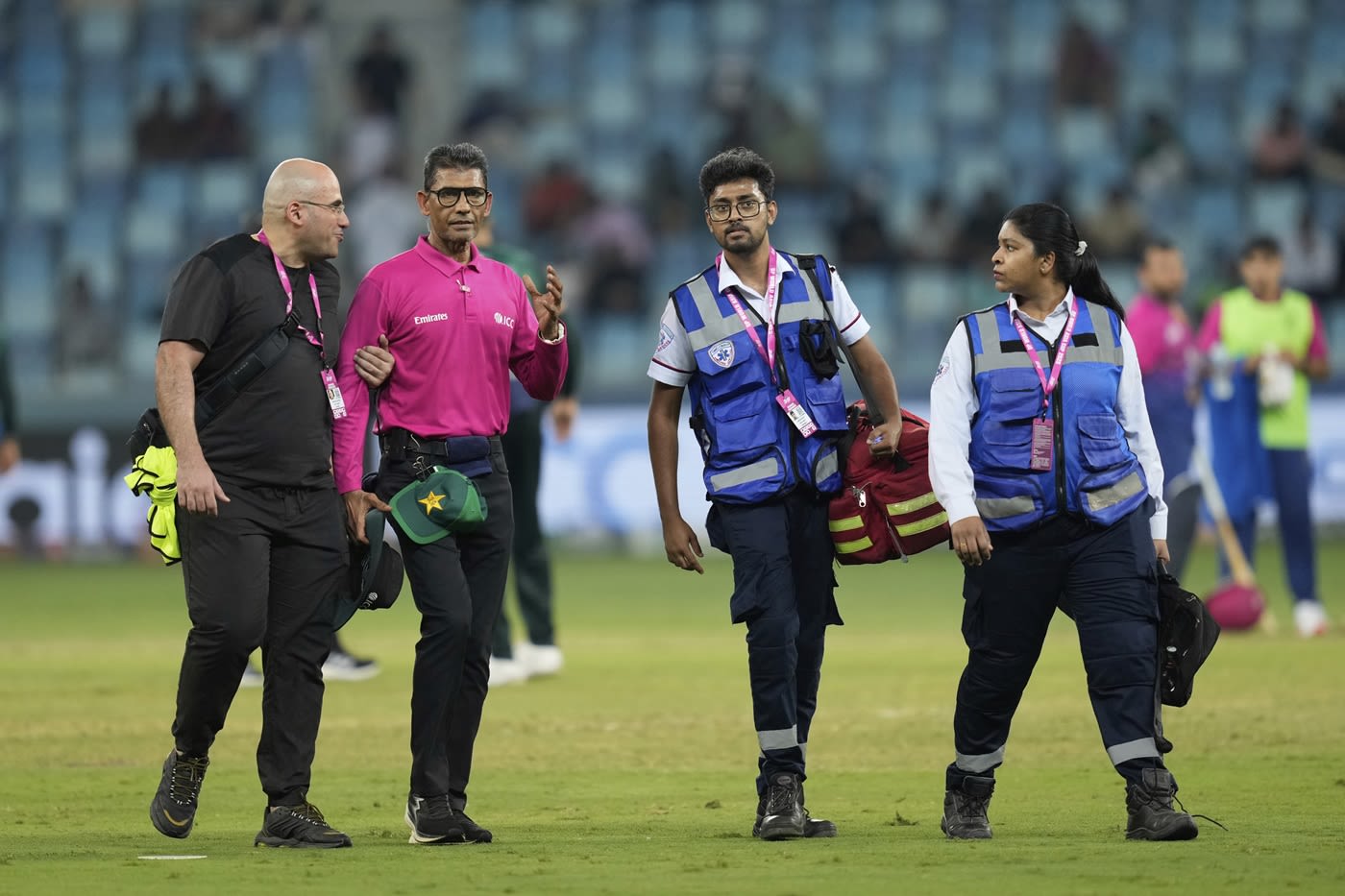 Umpire Ruchira Palliyaguruge is taken off the field after being hit by the ball