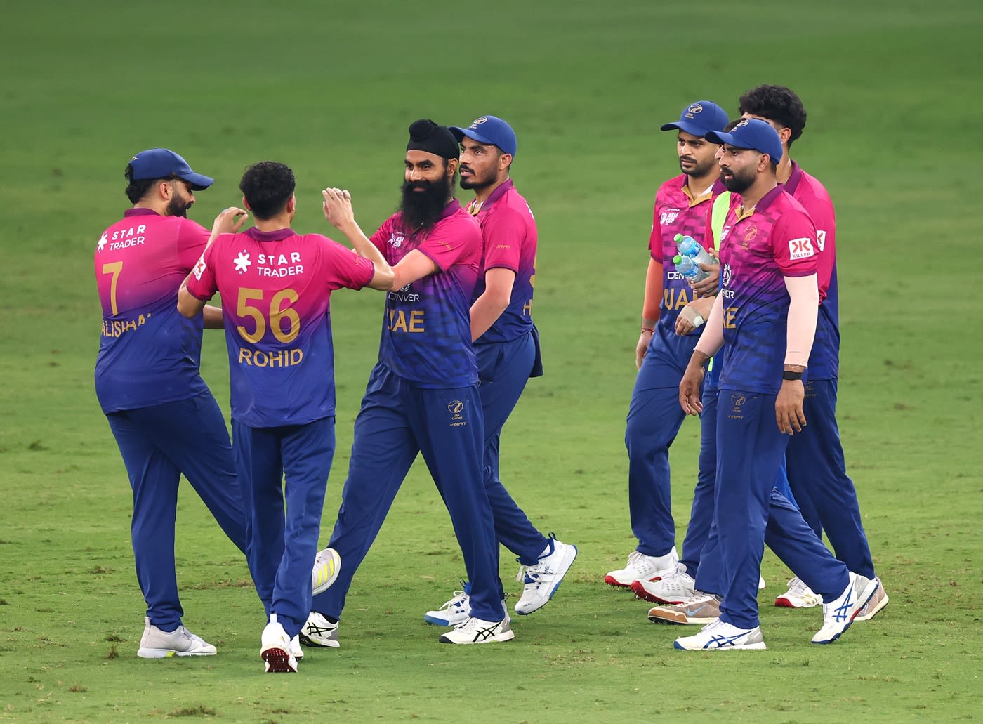 Simranjeet Singh celebrates a wicket with his team-mates