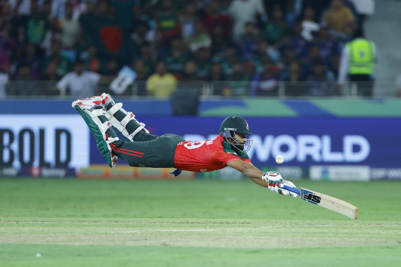 Shamim Hossain's full-stretch dive spares no effort