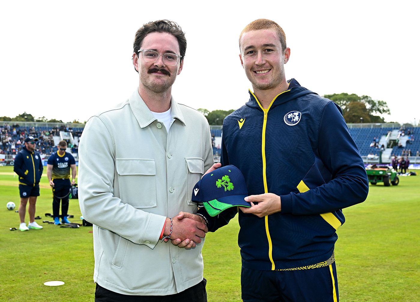 Ben Calitz receives his maiden T20I cap from Mark Adair