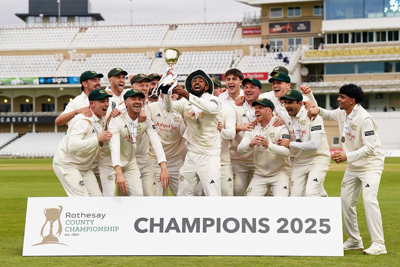 Haseeb Hameed holds the Championship trophy aloft