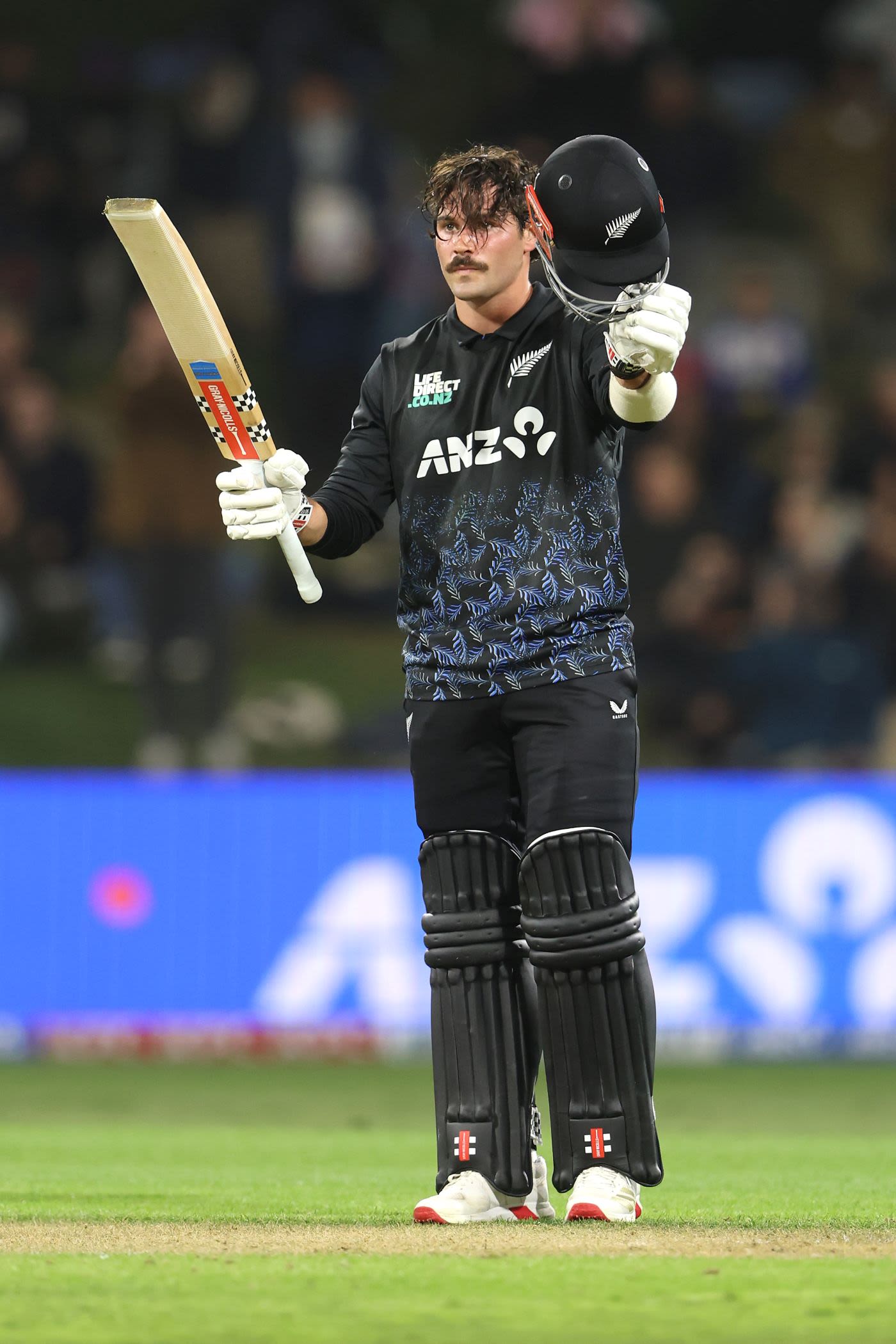Tim Robinson celebrates his maiden T20I century