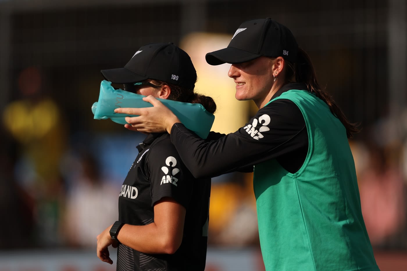 Substitute Rosemary Mair helps Eden Carson cool with an icepack