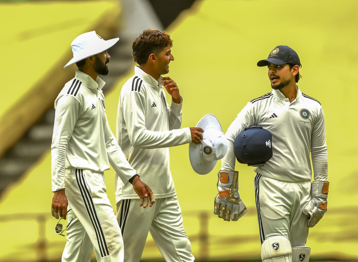 [L to R] Ruturaj Gaikwad, Yash Dhull and Ishan Kishan return after the day's play