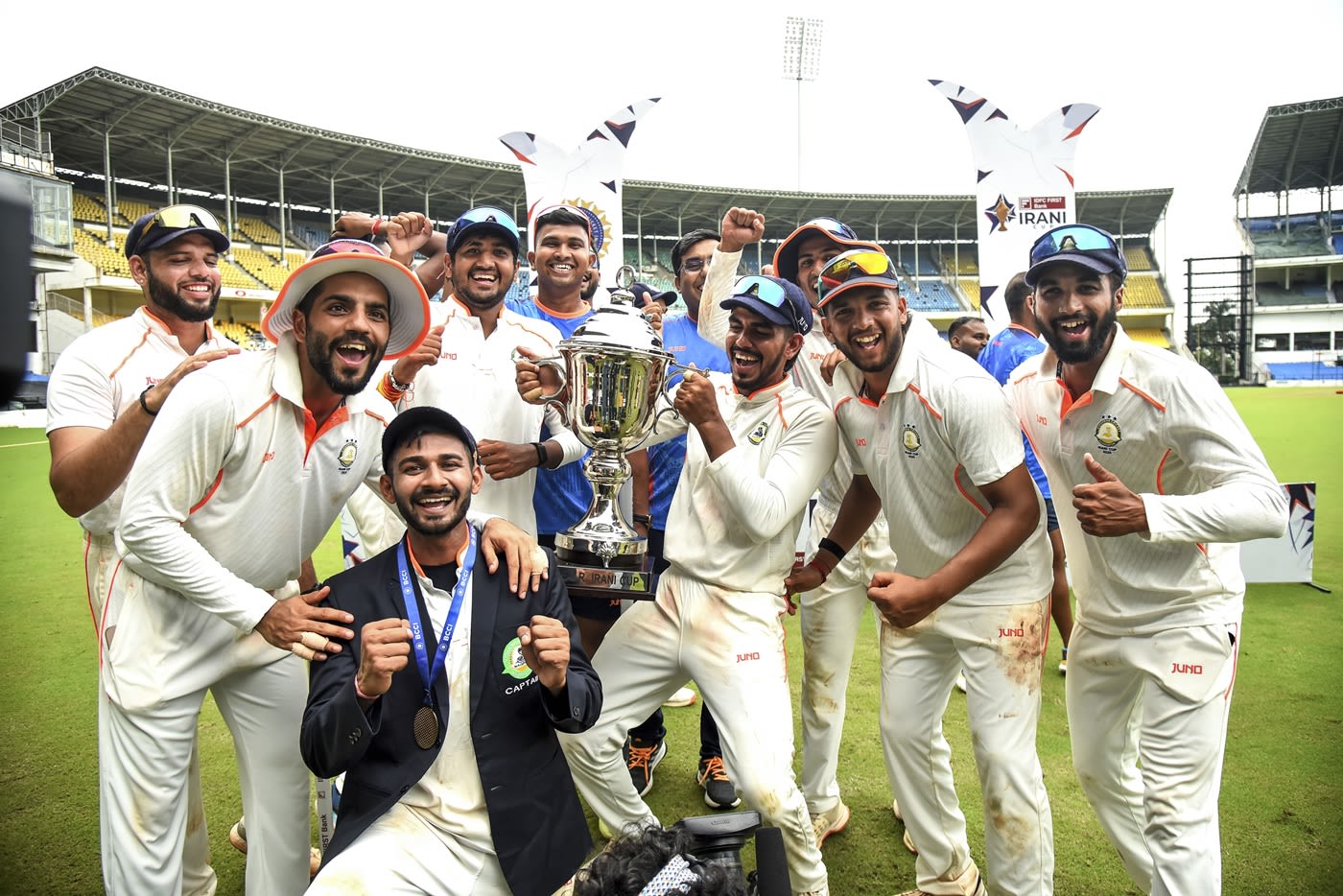 Vidarbha's players celebrate with the Irani Cup