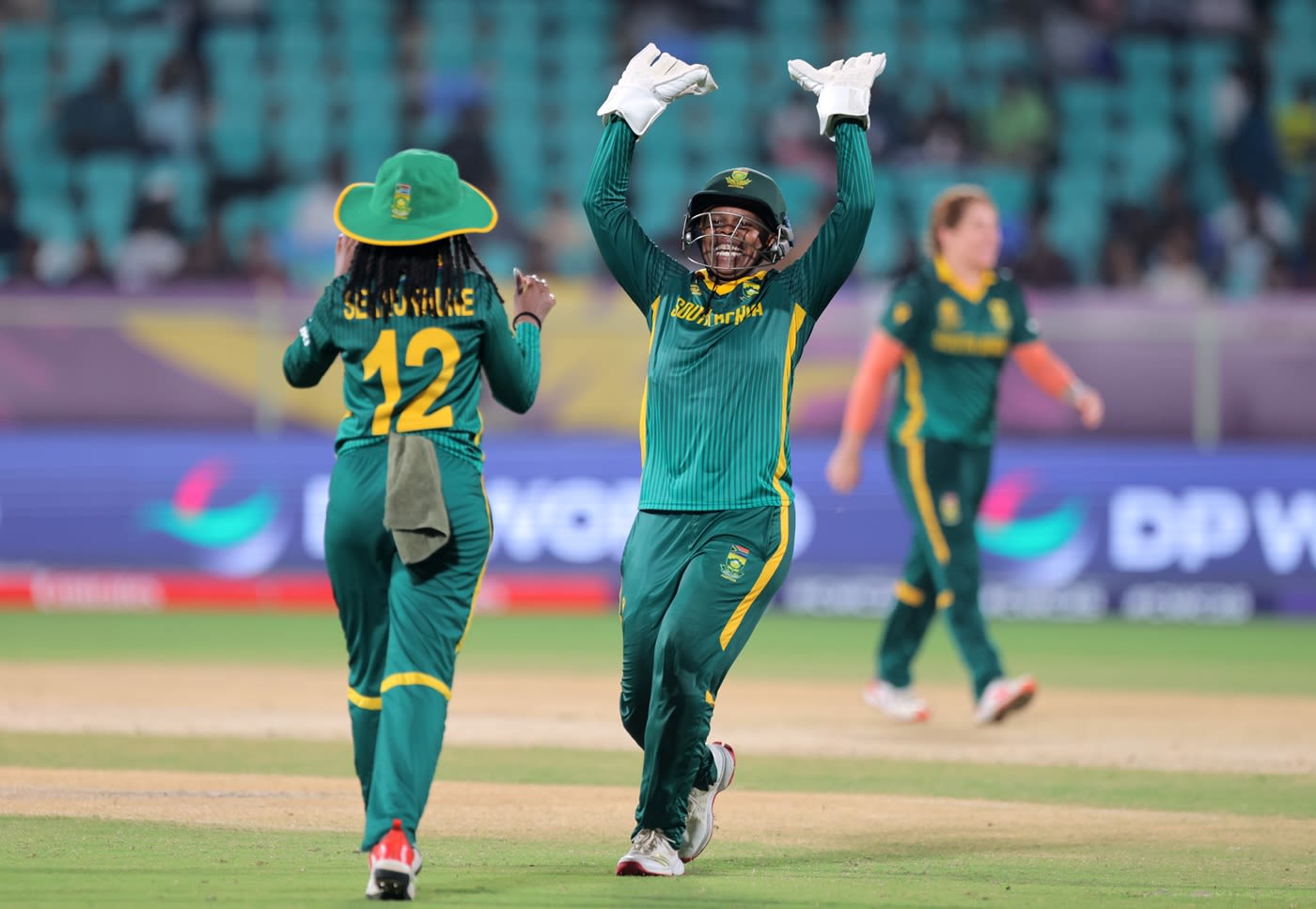 Sinalo Jafta runs to congratulate Tumi Sekhukhune for a direct hit
