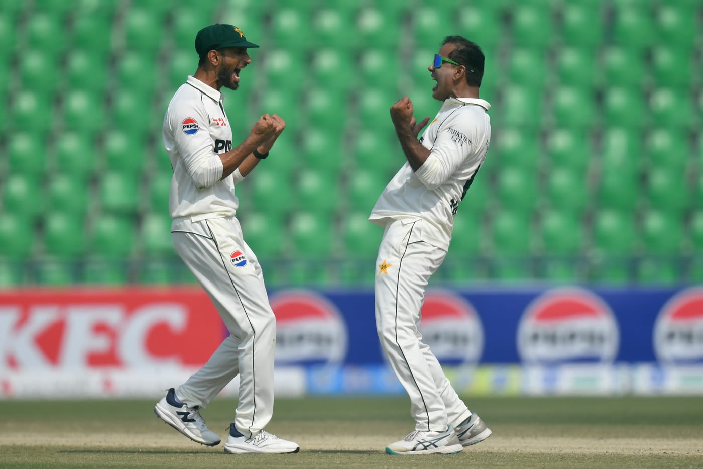 Shan Masood and Noman Ali celebrate Dewald Brevis' wicket