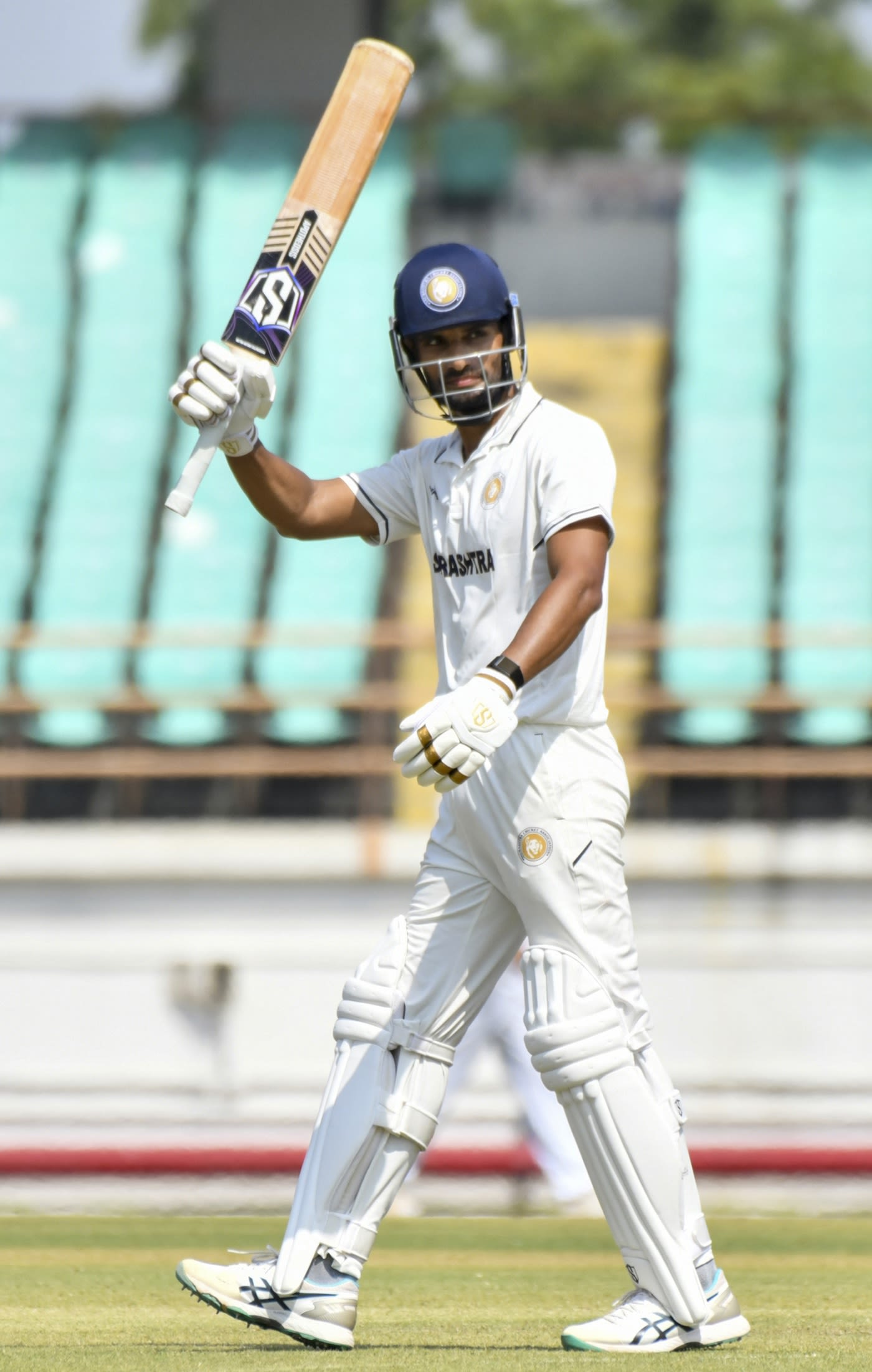 Chirag Jani celebrates after scoring a fifty