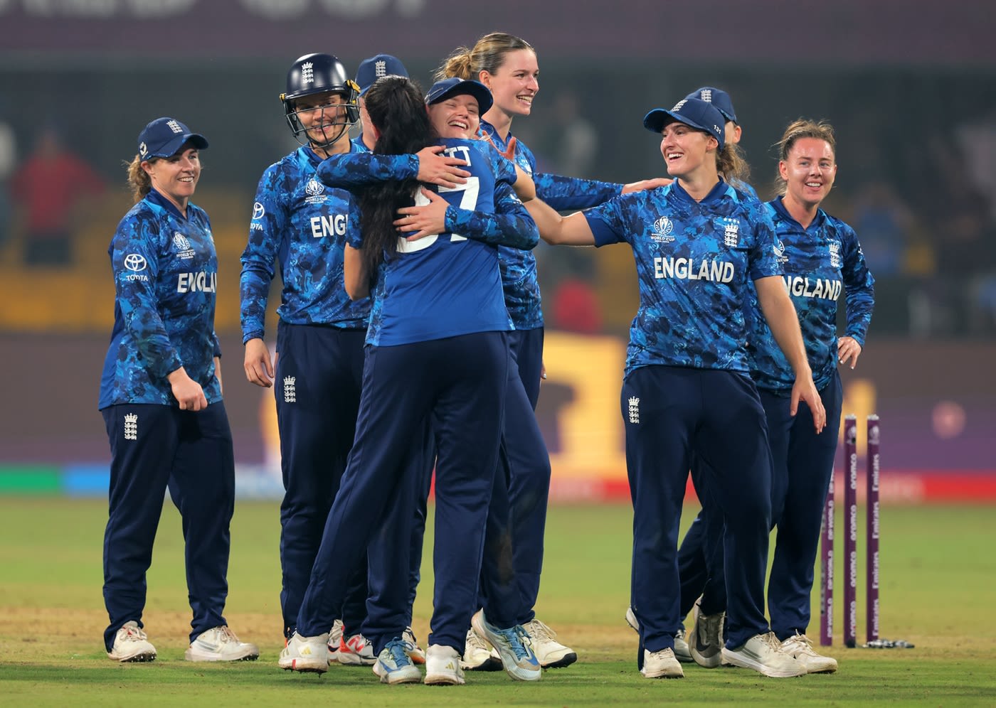 England celebrate after qualifying for the semi-final with a four-run win against India