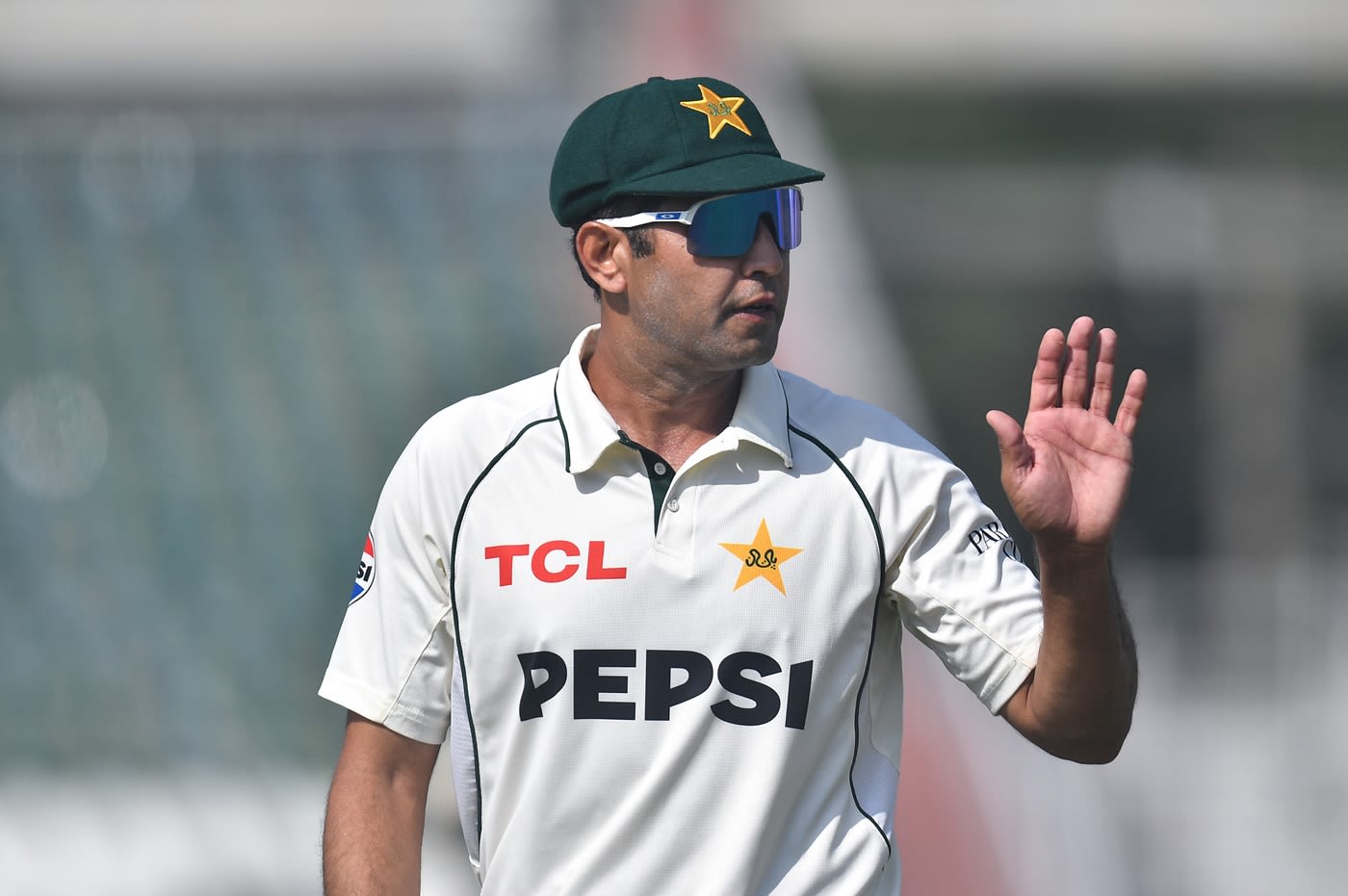 Asif Afridi waves to the crowd after picking up five wickets
