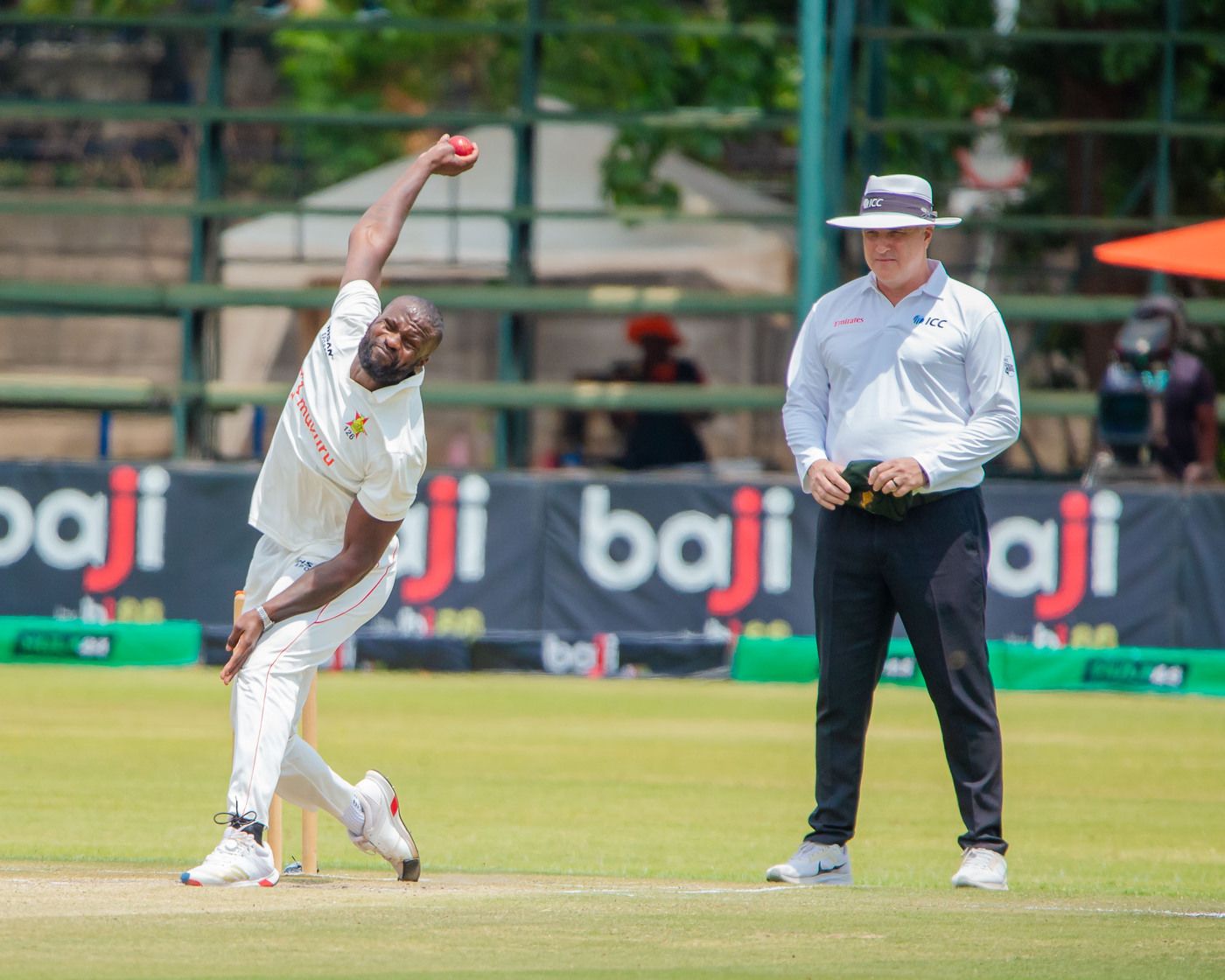 Tanaka Chivanga runs in to bowl a delivery
