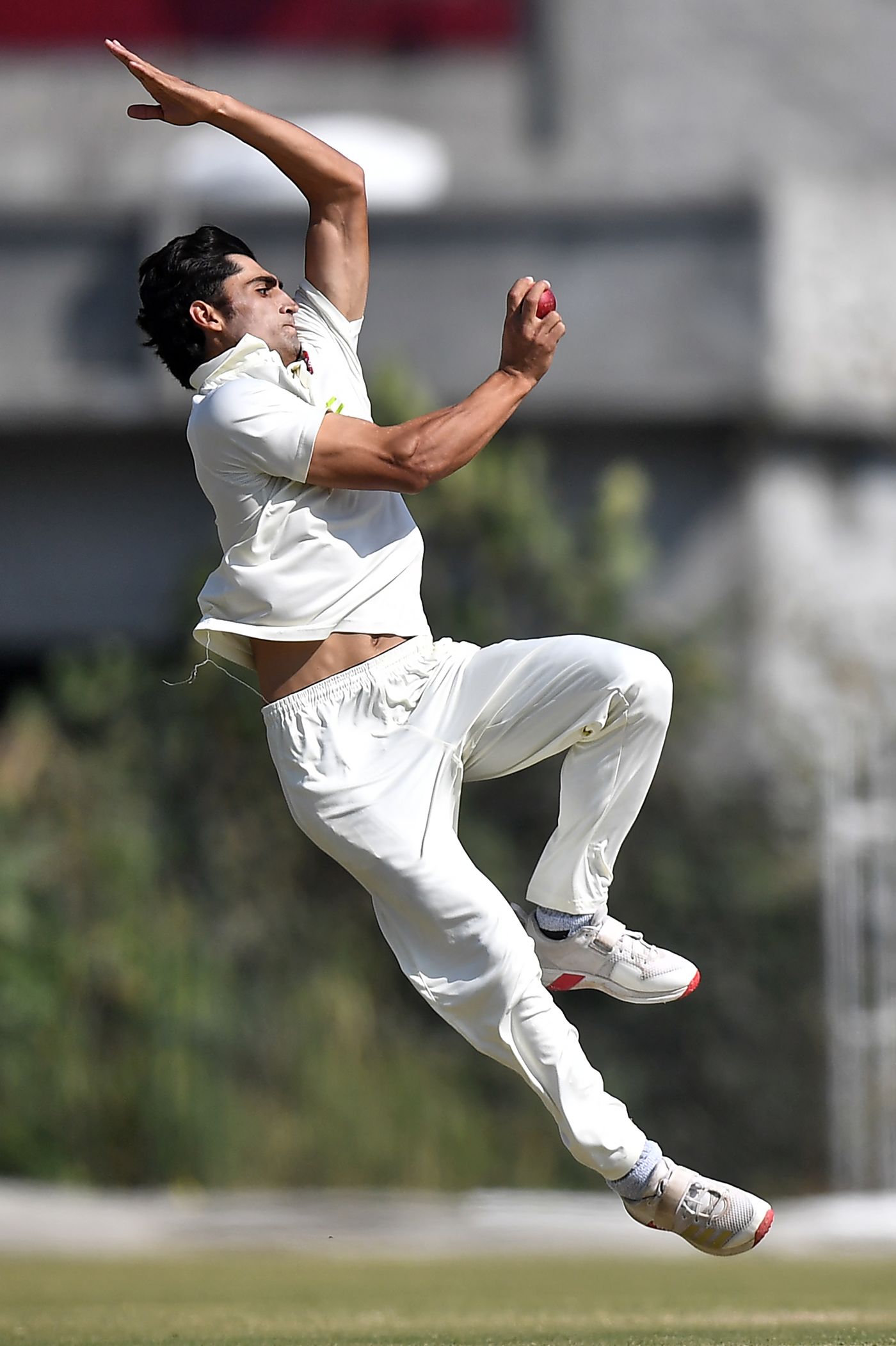 Ubaid Shah runs in to bowl a delivery