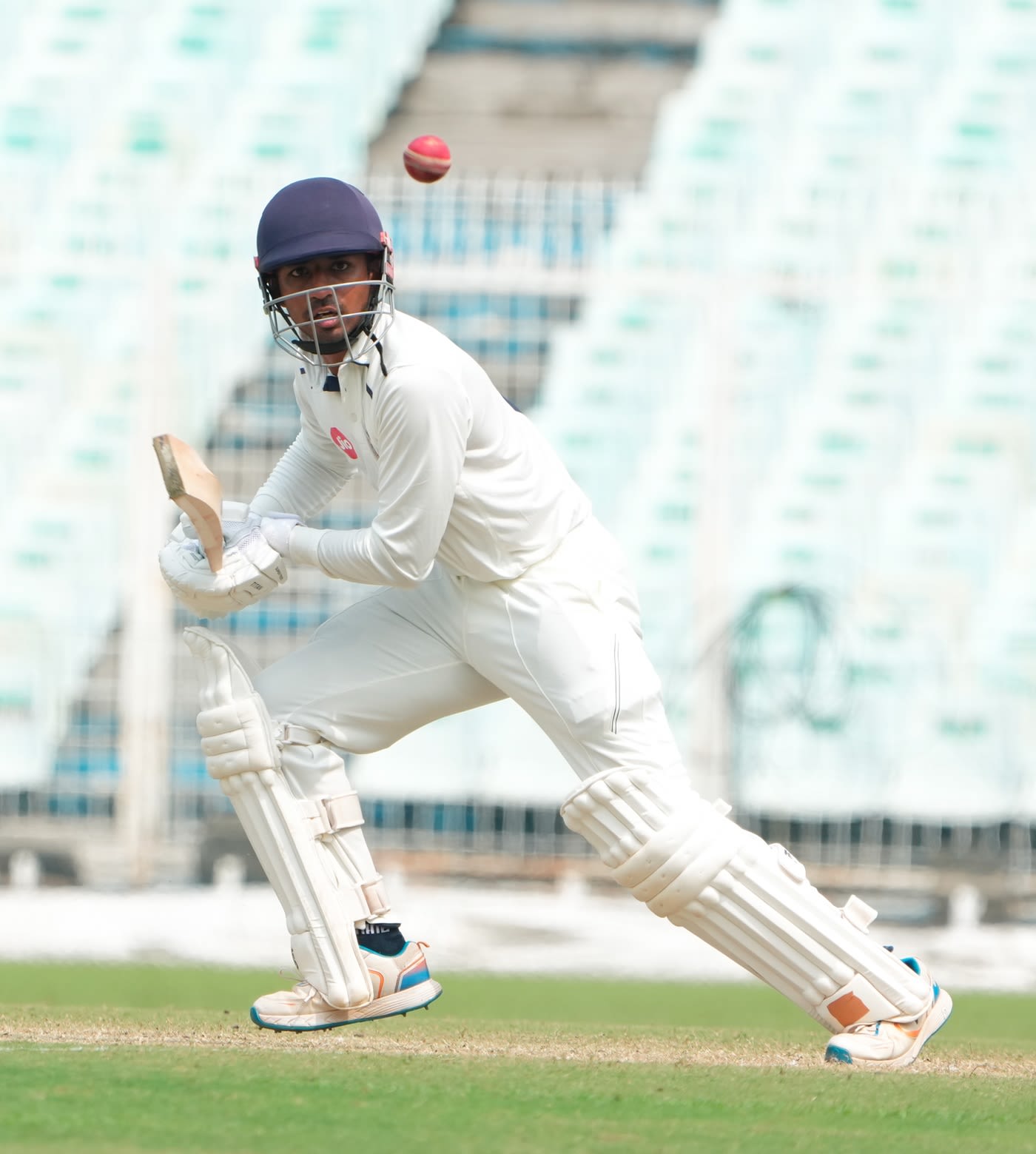 Siddharth Desai taps the ball away