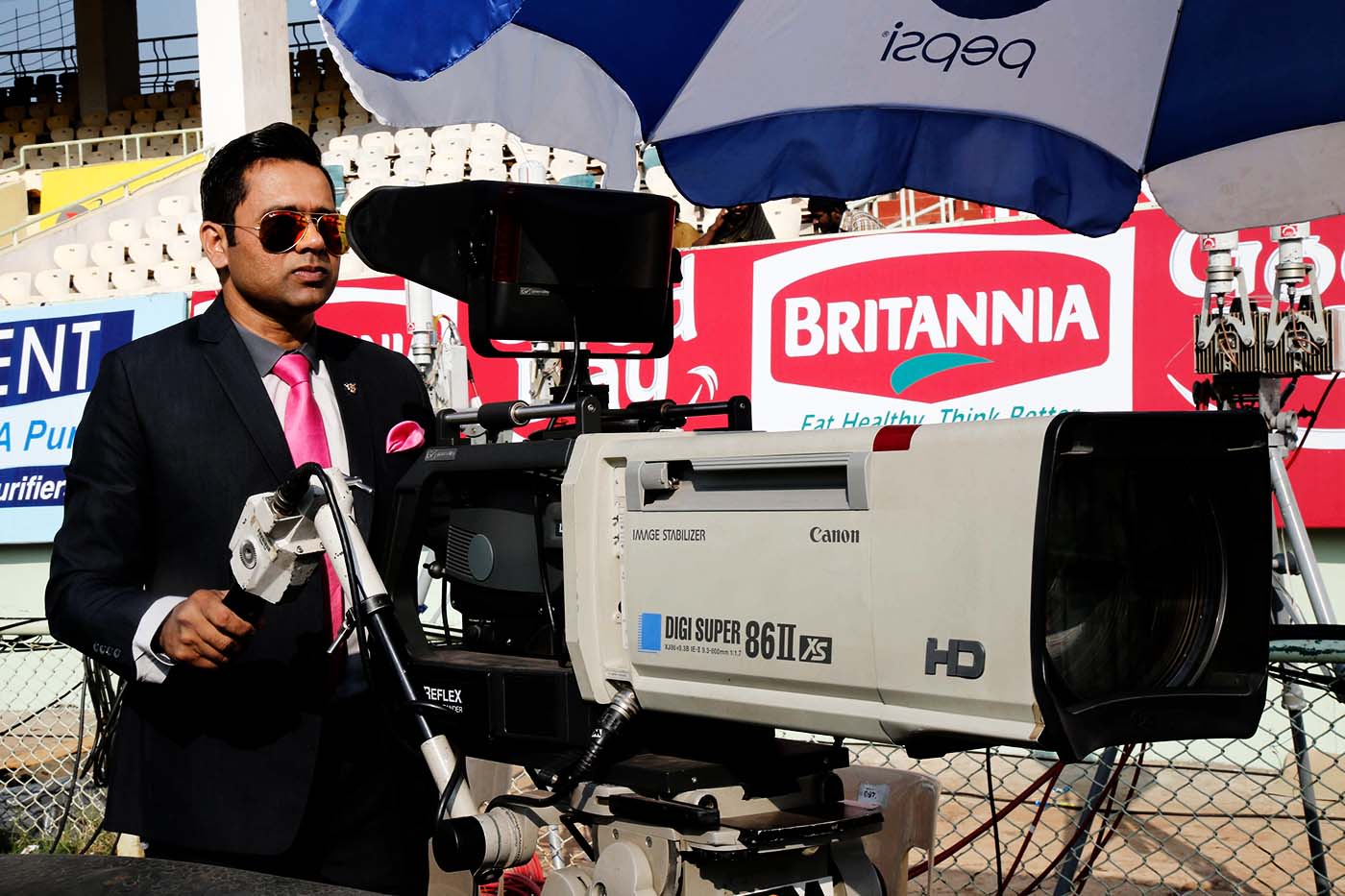Commentator Aakash Chopra stands behind the camera