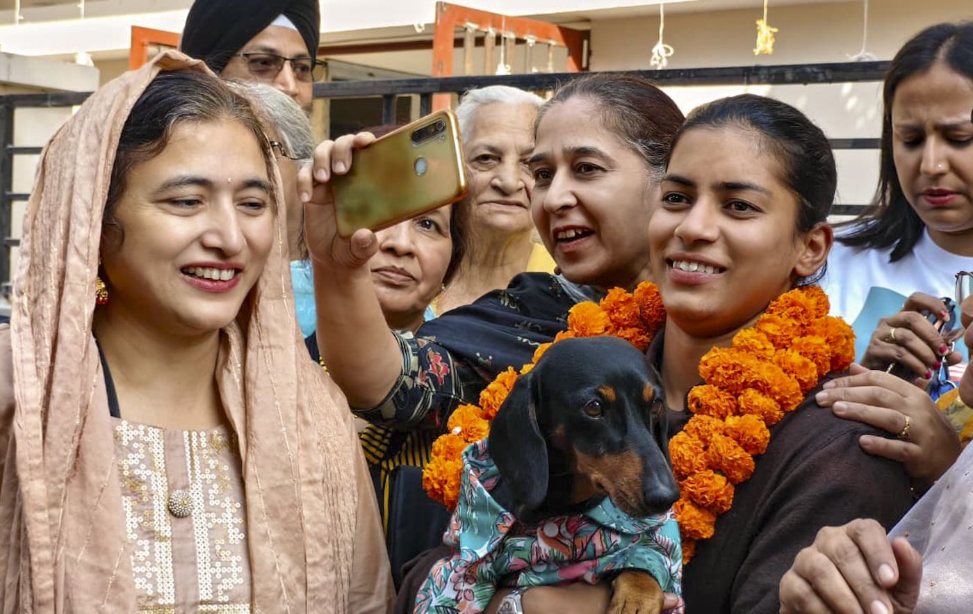 World Cup winner Amanjot Kaur (and her canine friend) get a warm reception in her hometown, Mohali