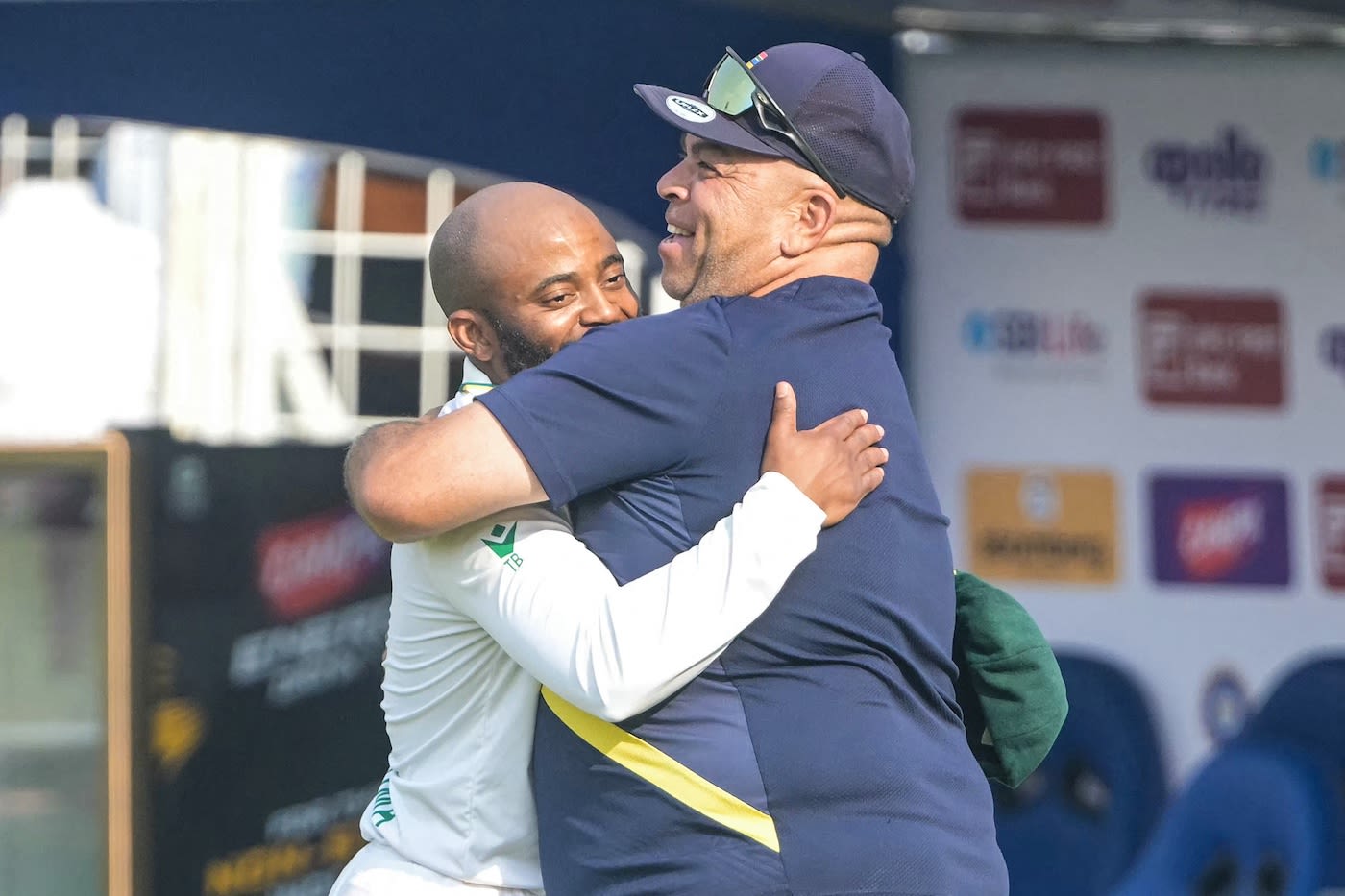 Temba Bavuma and Shukri Conrad hug after the game