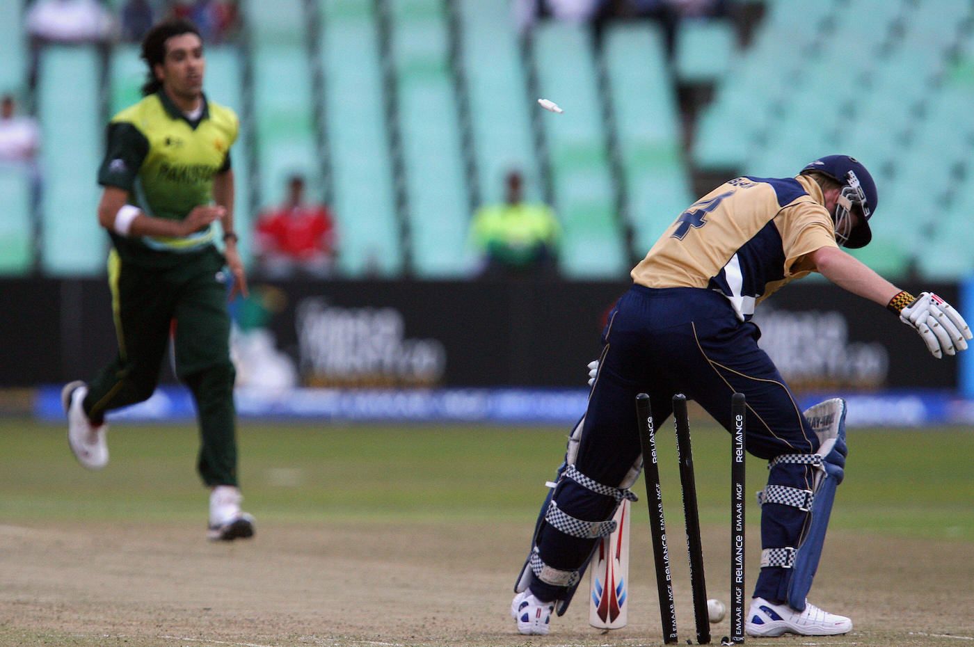 John Blain trods onto his stumps off Umar Gul