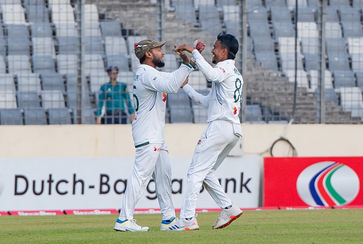 Hasan Murad celebrates a wicket with Mushfiqur Rahim