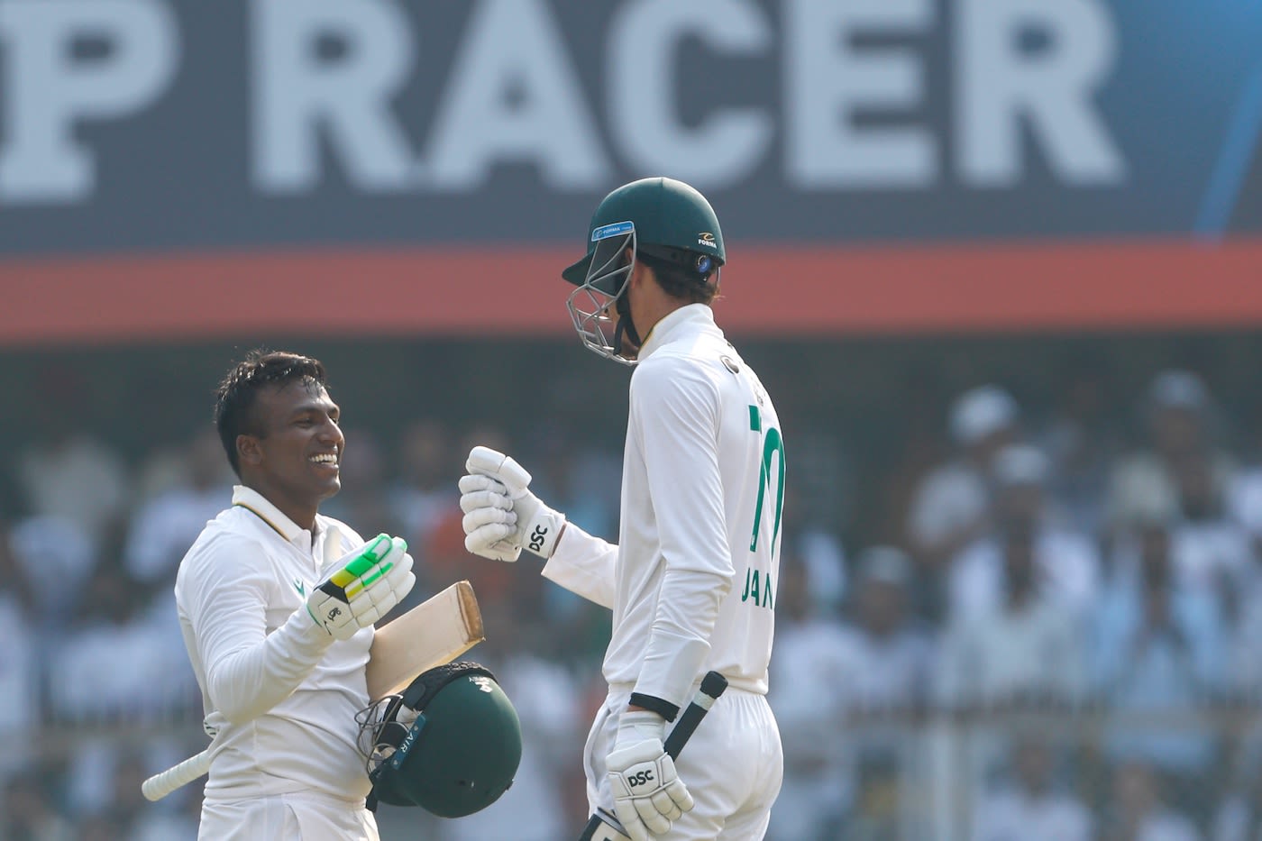 Senuran Muthusamy celebrates with Marco Jansen after getting to his century