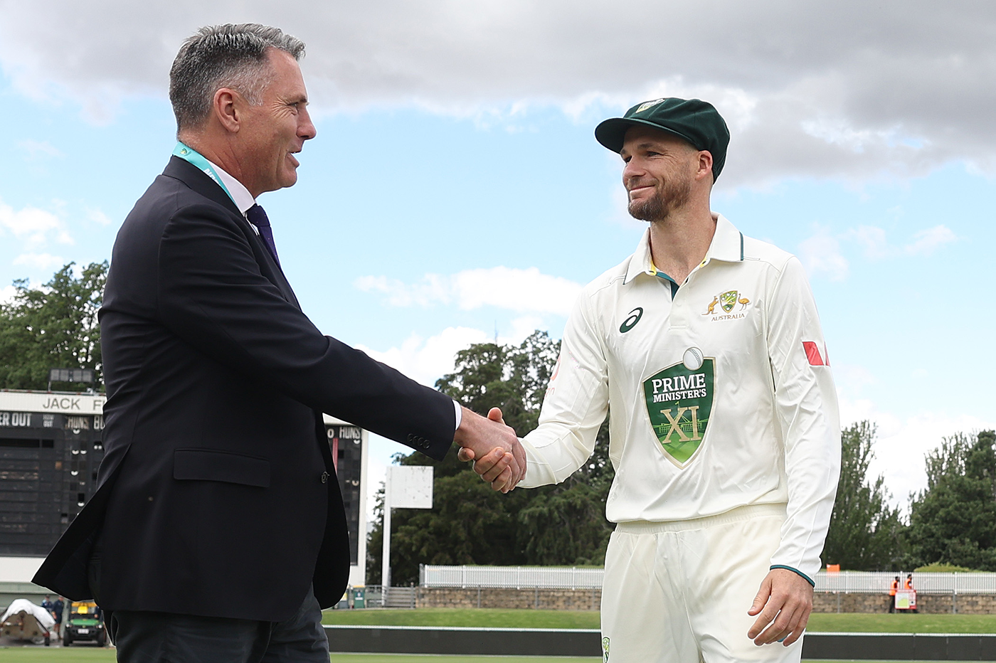 Peter Handscomb shakes hands with Deputy Prime Minister Richard Marles