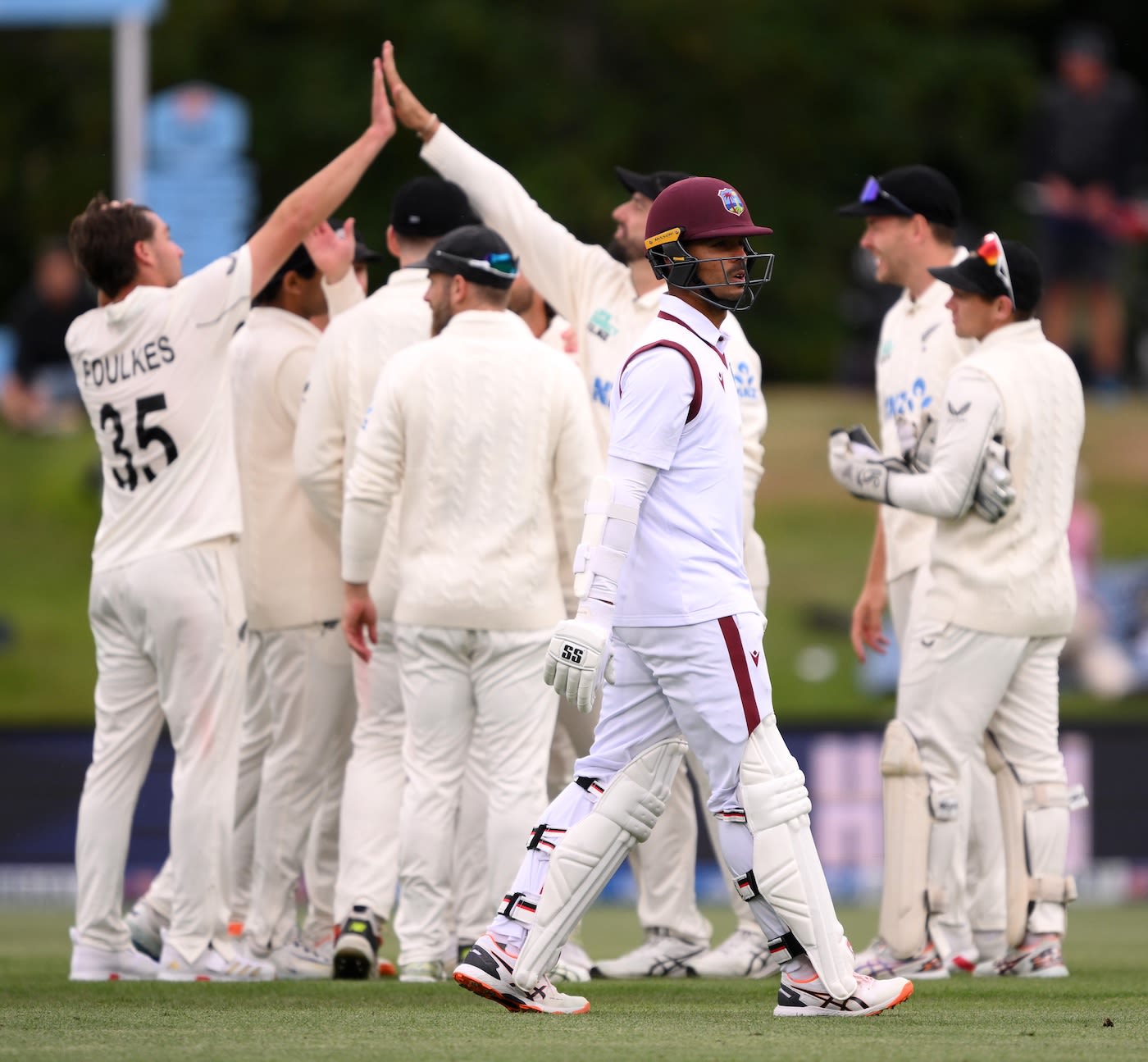 Tagenarine Chanderpaul walks back after being dismissed by Zak Foulkes