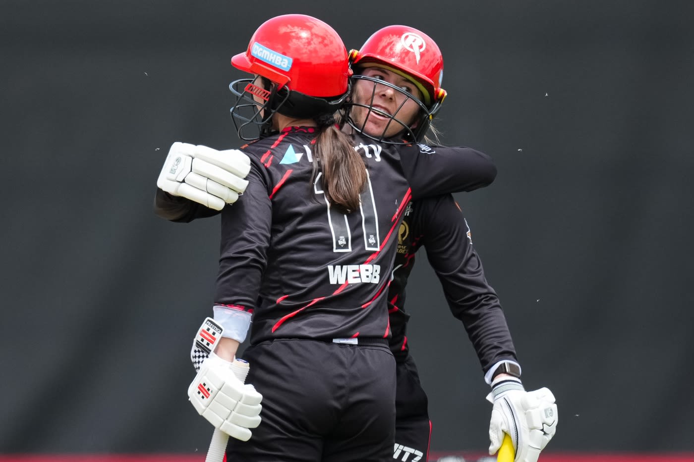Georgia Wareham celebrates hitting the winning runs with Courtney Webb