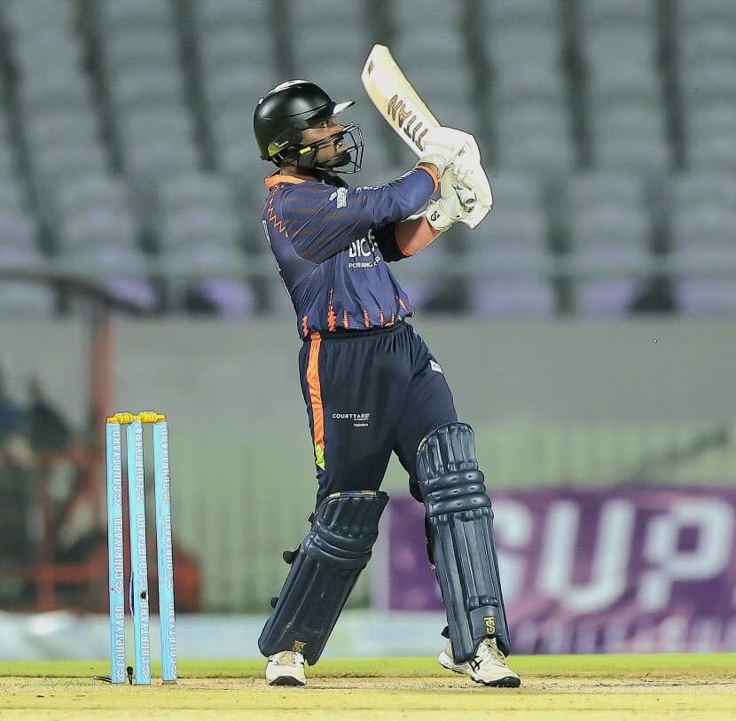 Amit Pasi powers the ball away