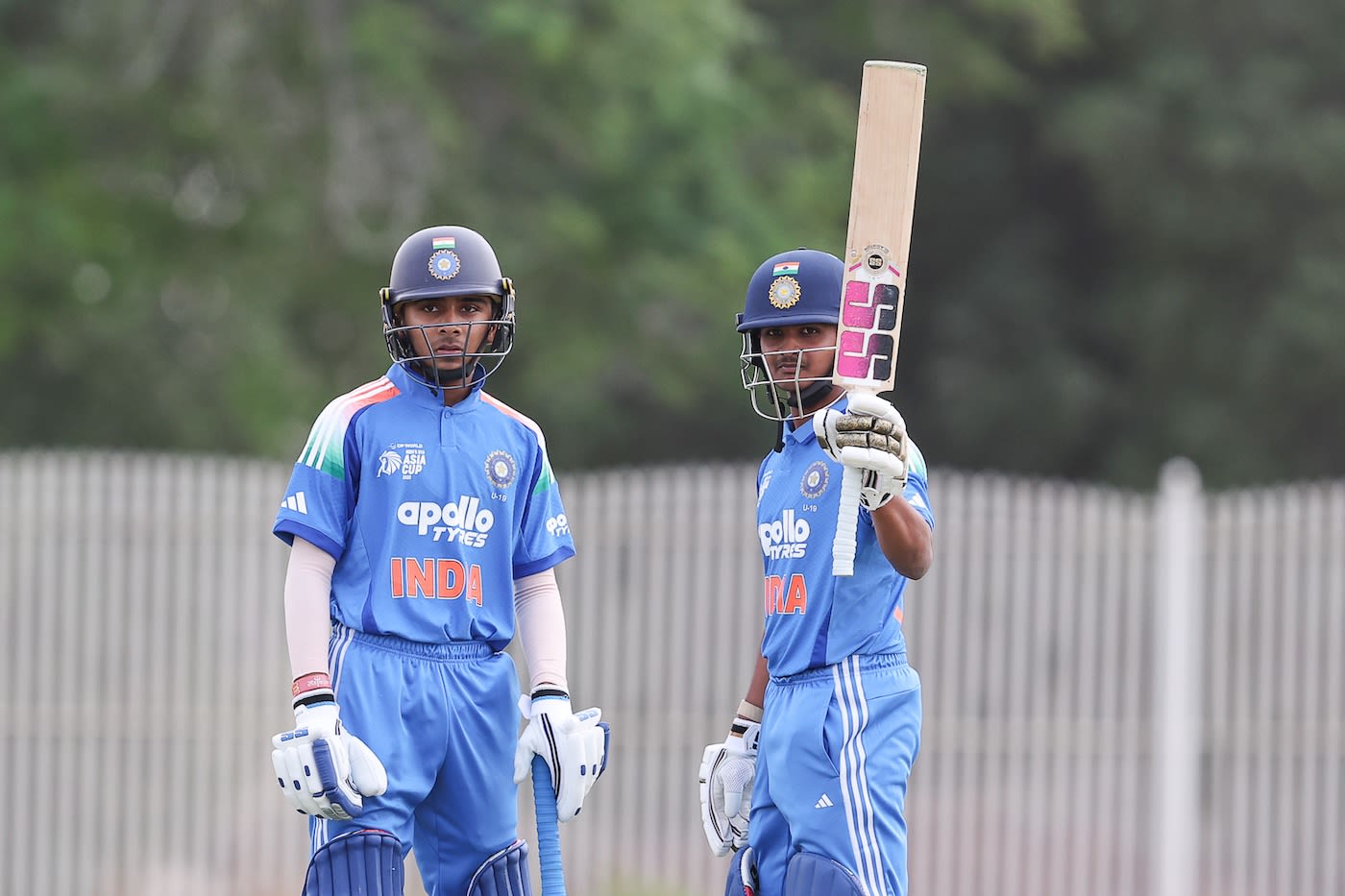 Abhigyan Kundu celebrates his century as vedant Trivedi looks on