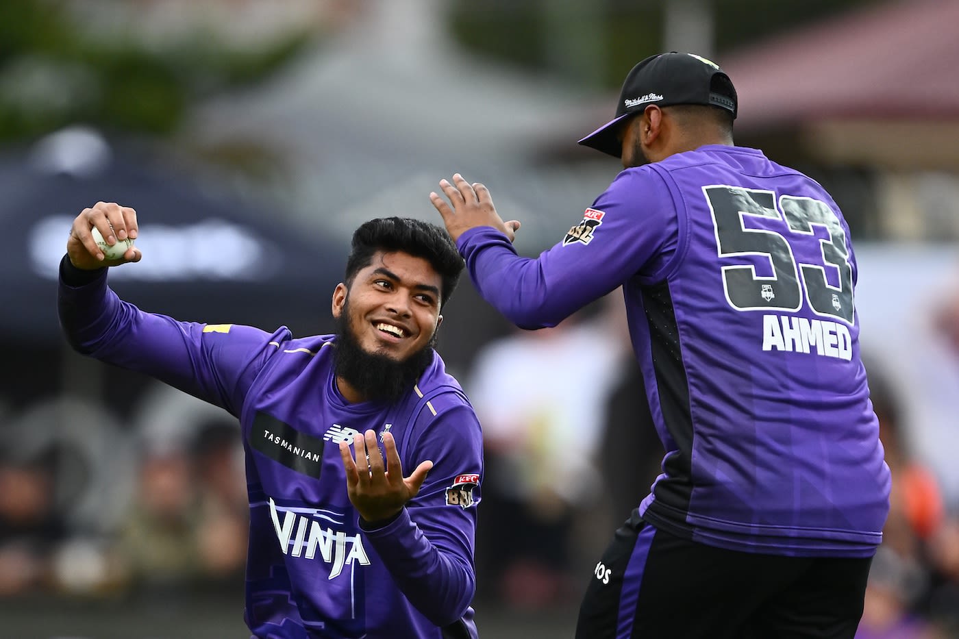 Rishad Hossain looks pleased after taking the catch to dismiss Josh Brown