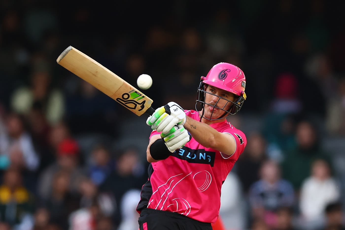 Daniel Hughes swings the ball away