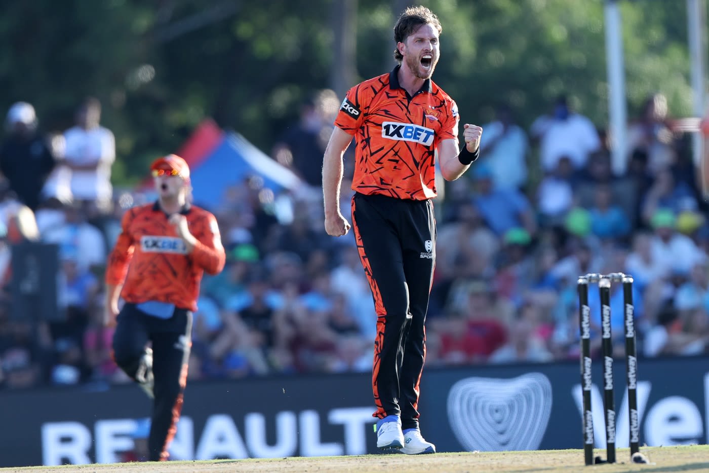 Adam Milne celebrates after getting rid of Shai Hope