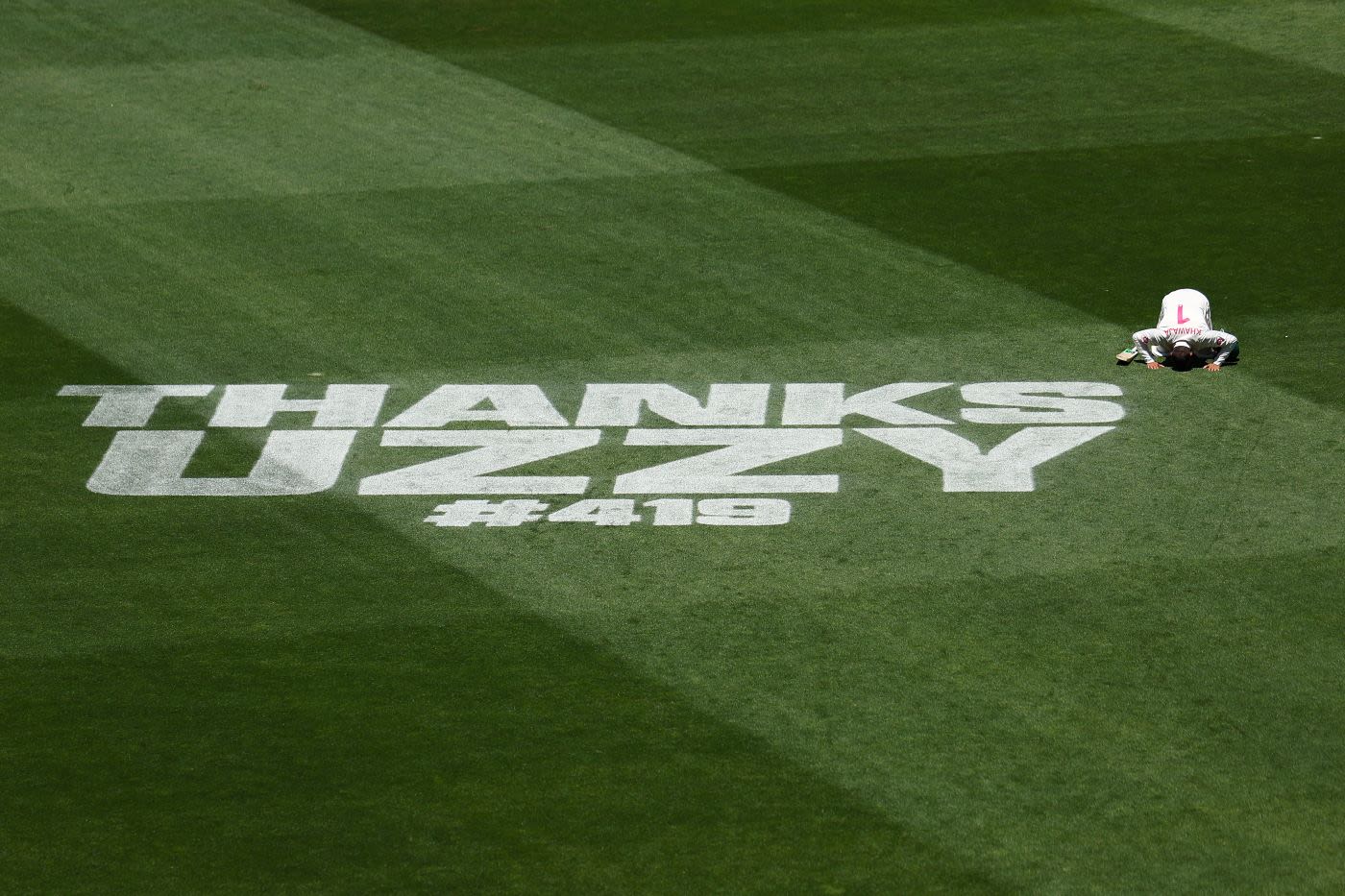 Usman Khawaja kneels and prays on the SCG after being dismissed in Test cricket for the final time