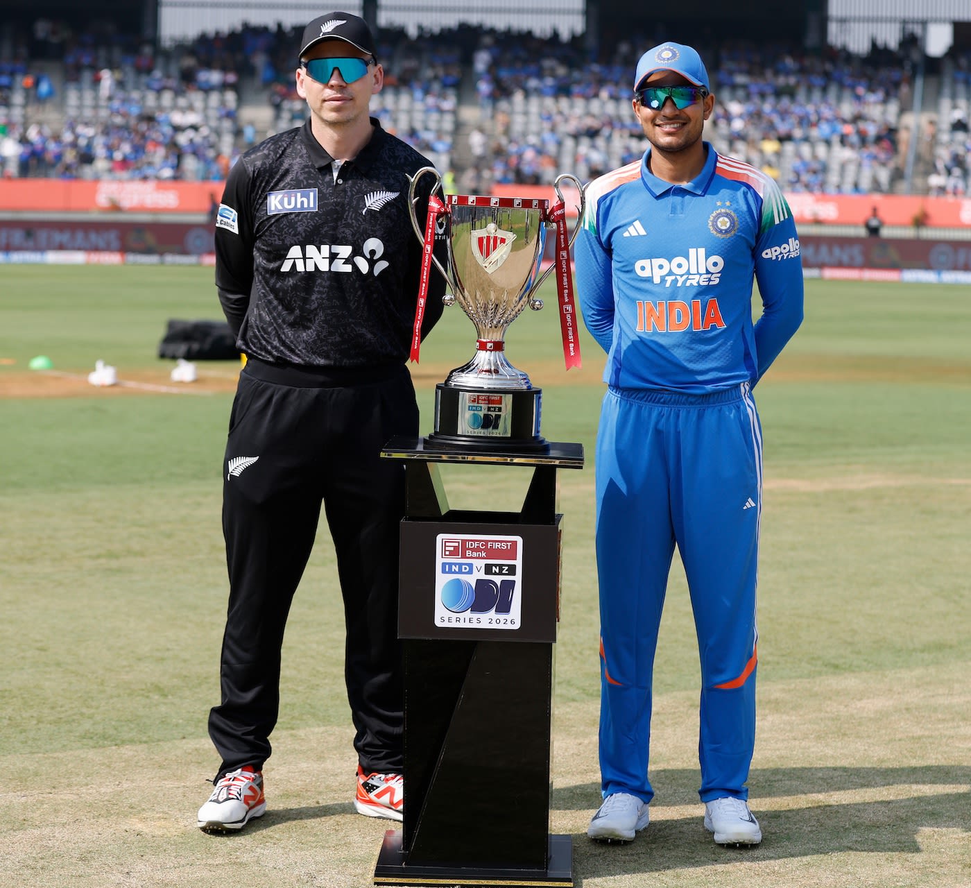 Michael Bracewell and Shubman Gill pose with the series trophy