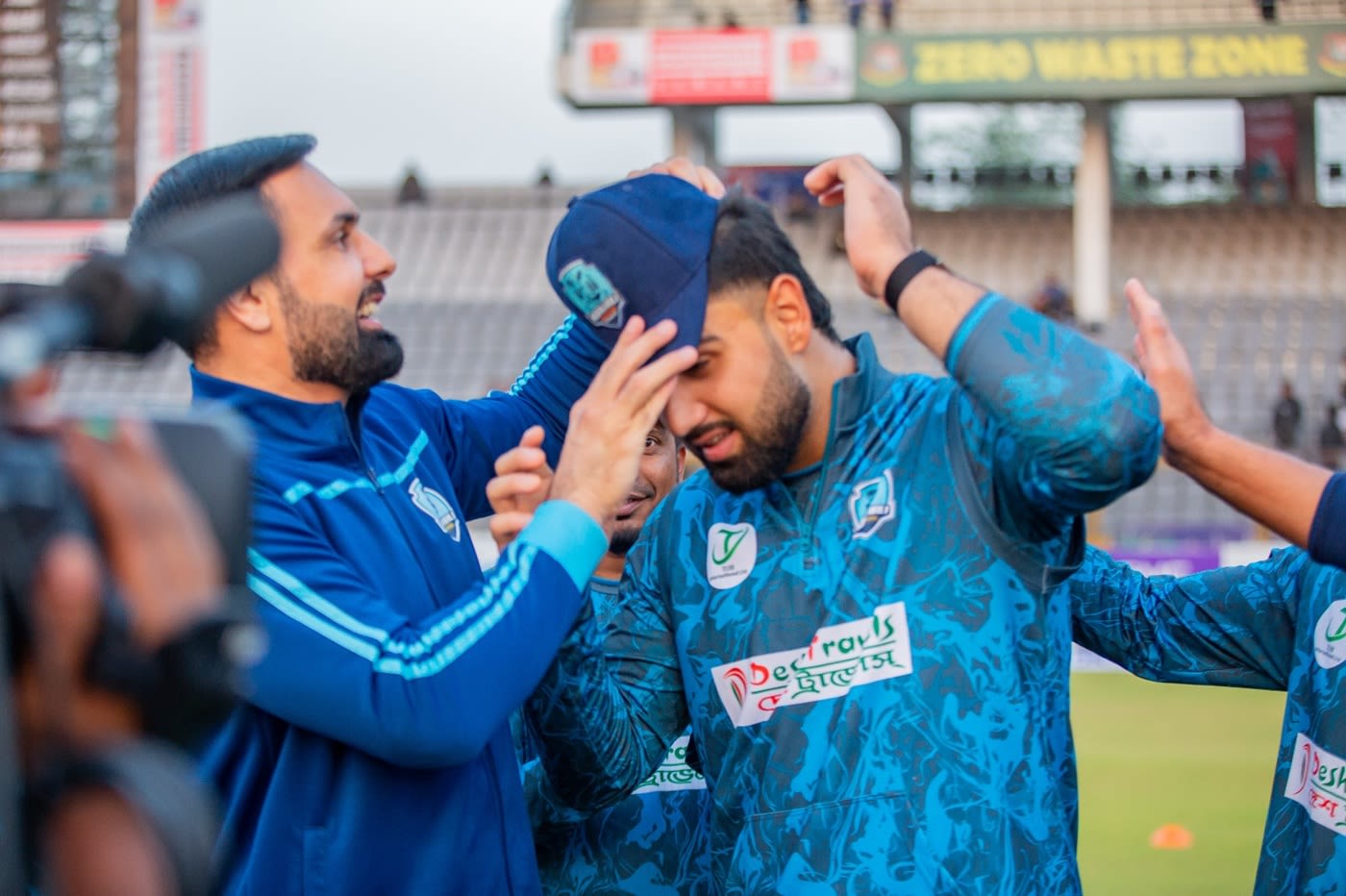 Mohammad Nabi presents his son Hassan Eisakhil with his BPL cap on debut