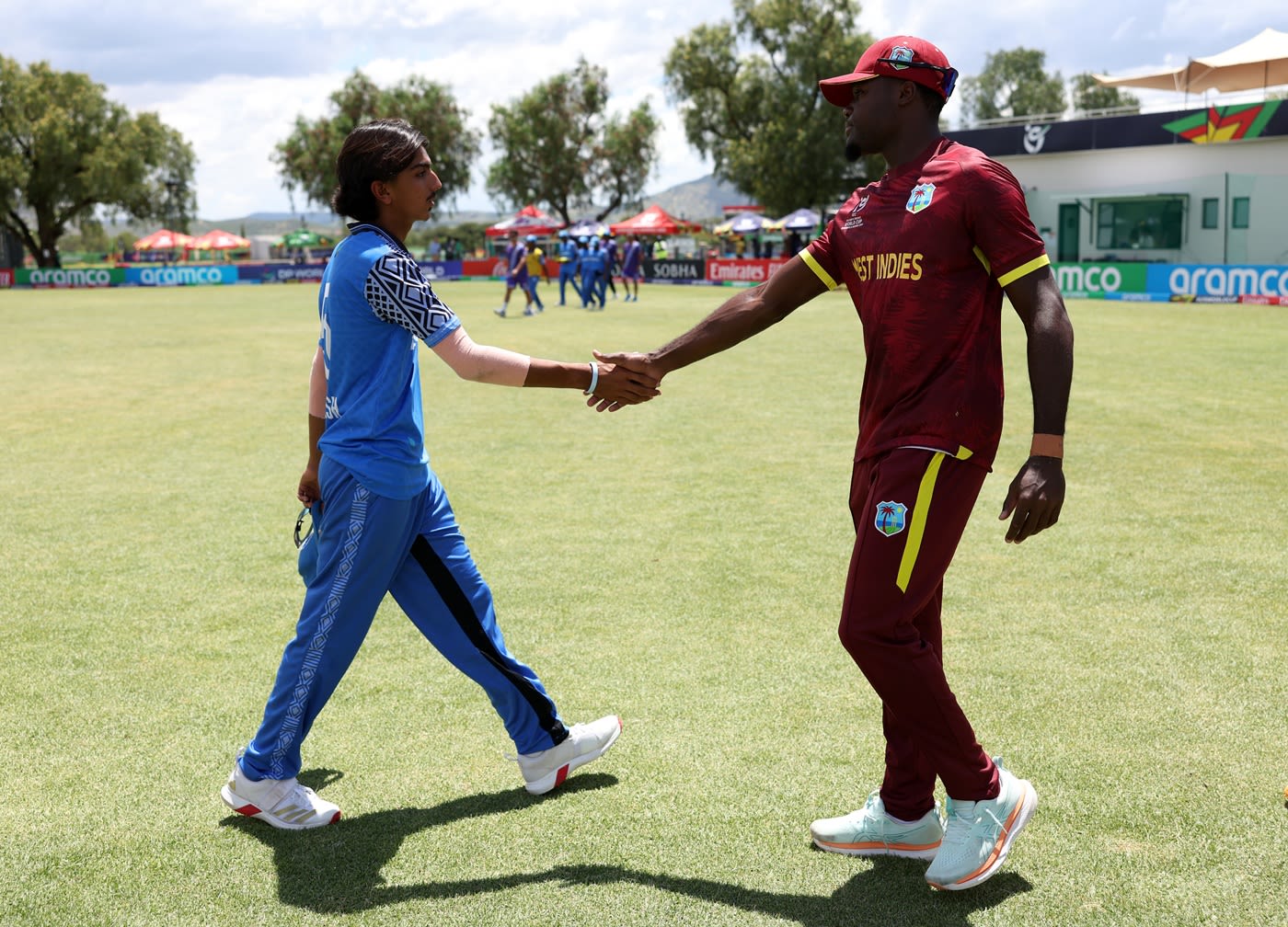Joshua Dorne and Laksh Bakrania shake hands after the game